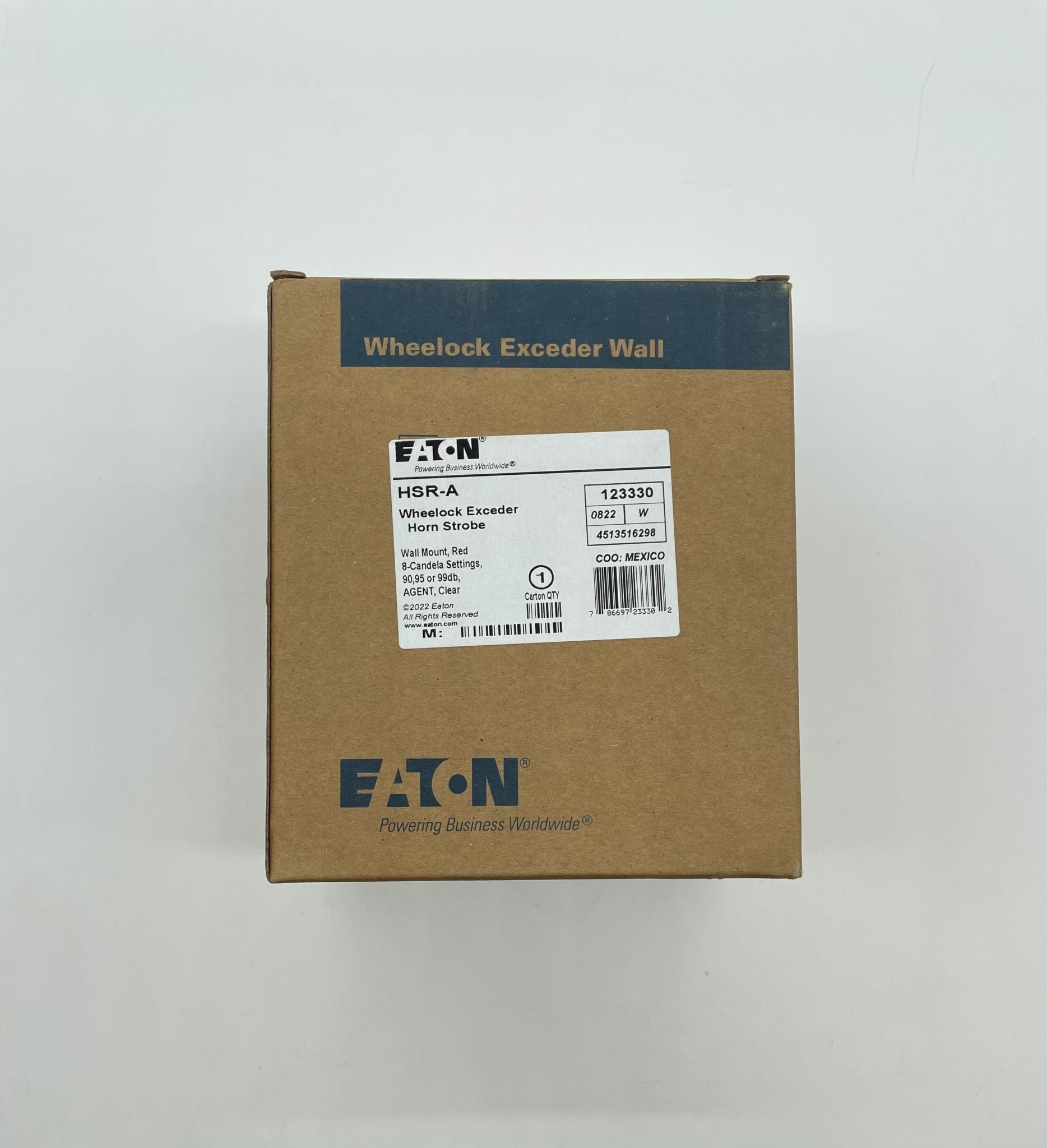 Eaton Wheelock HSR-A horn strobe with red housing and clear lens, mounted on a wall for fire alarm notification.