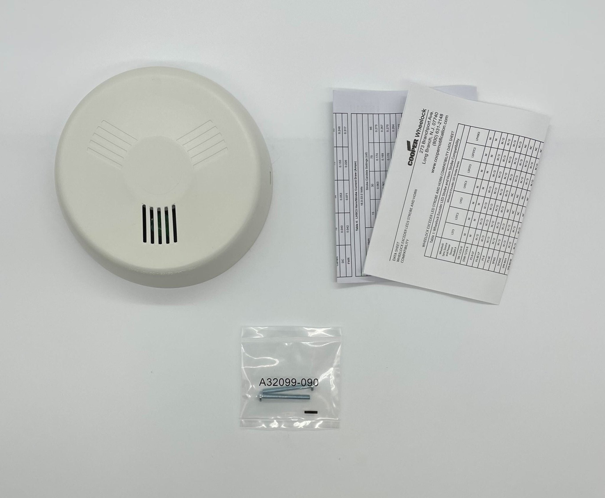 Eaton Wheelock LHNWC3 fire alarm horn strobe with black housing and visible mounting bracket.
