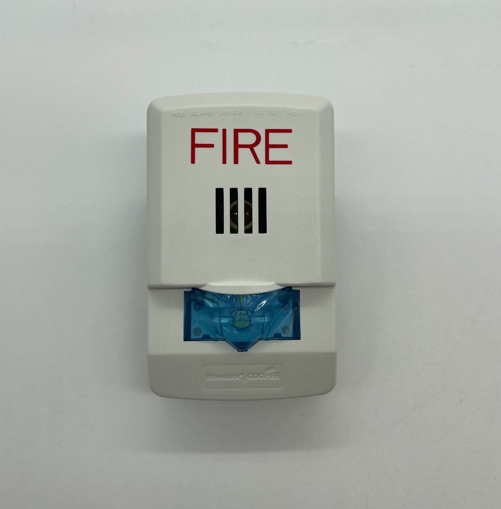 Eaton Wheelock LHSW horn strobe with white cover and mounting plate, designed for emergency alert systems.