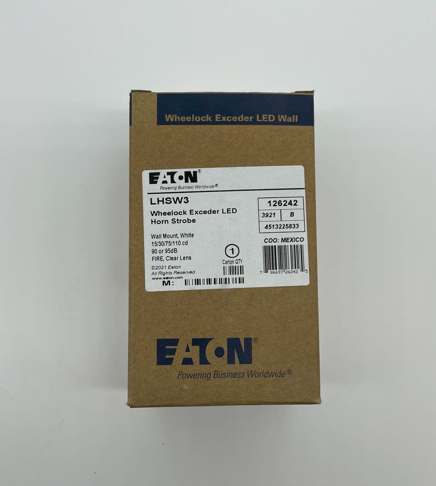 Eaton Wheelock LHSW3 horn strobe alarm device with yellow housing and mounting bracket for fire alarm systems.