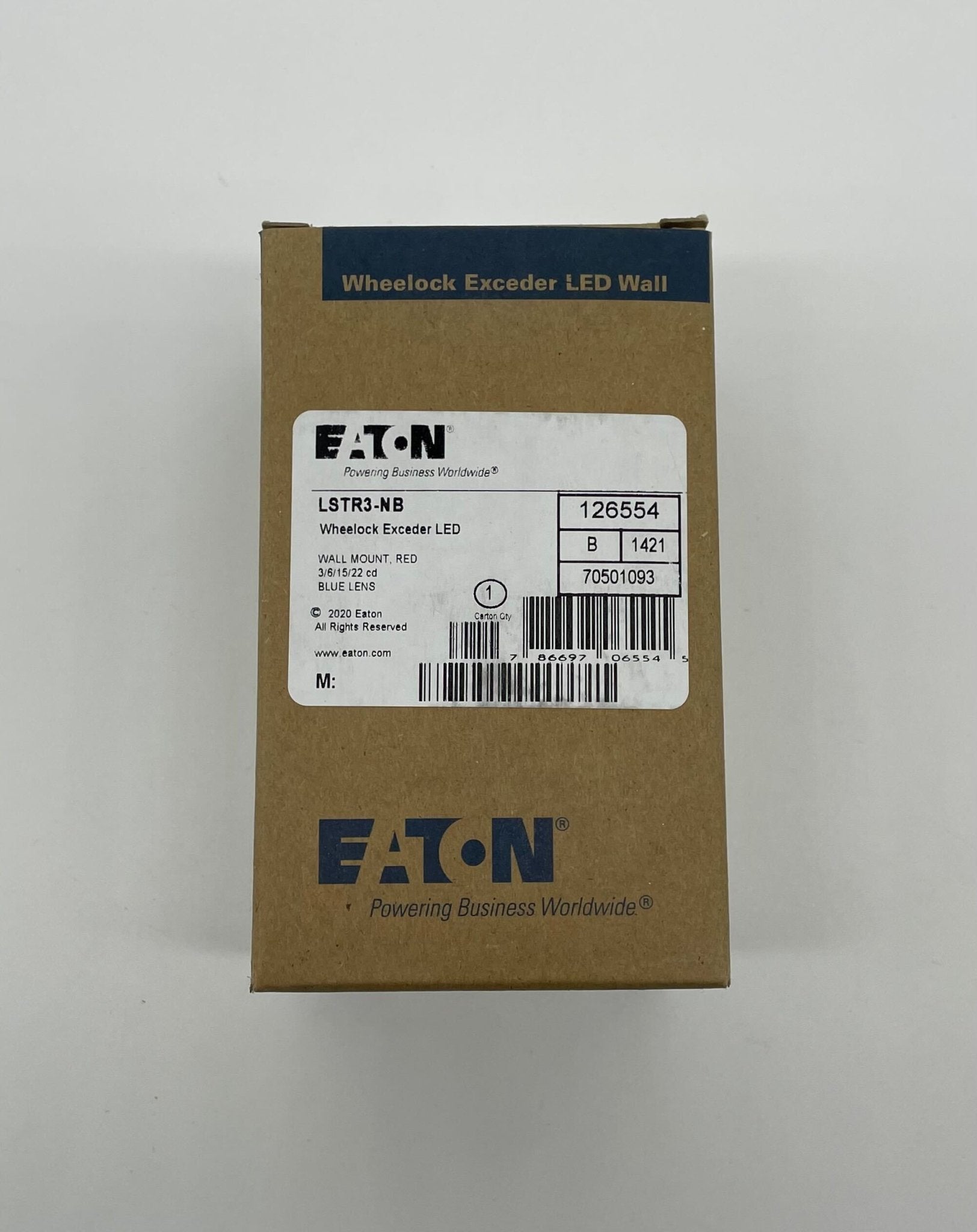 Eaton Wheelock LSTR3-NB strobe light with clear lens and mounting base, designed for emergency signaling and alarms.