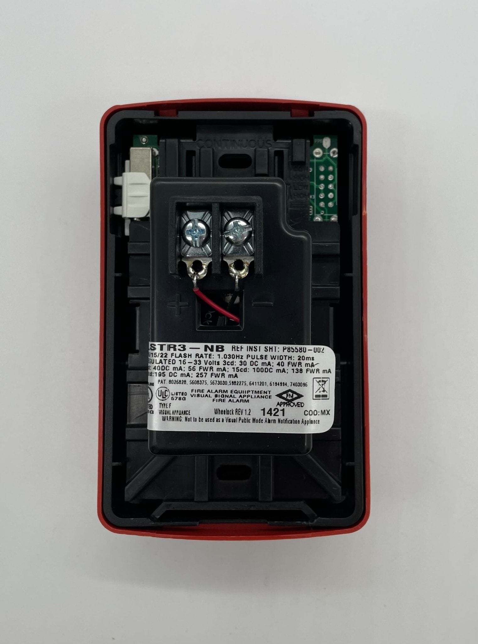 Eaton Wheelock LSTR3-NB strobe light with clear lens and mounting bracket, designed for emergency warning systems.