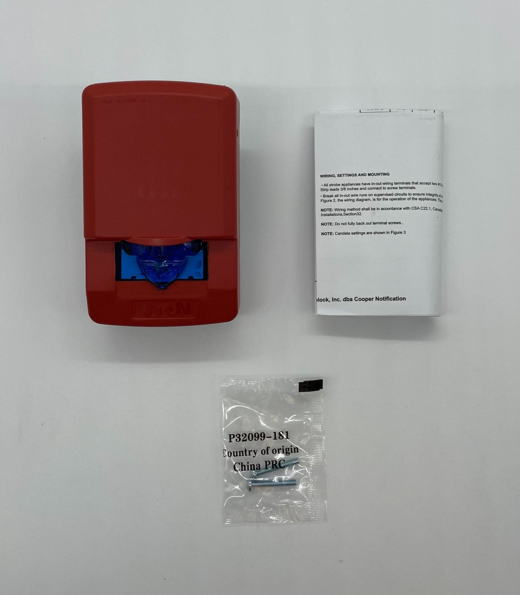 Eaton Wheelock LSTR3-NB strobe light with white housing and clear lens, mounted on a ceiling.