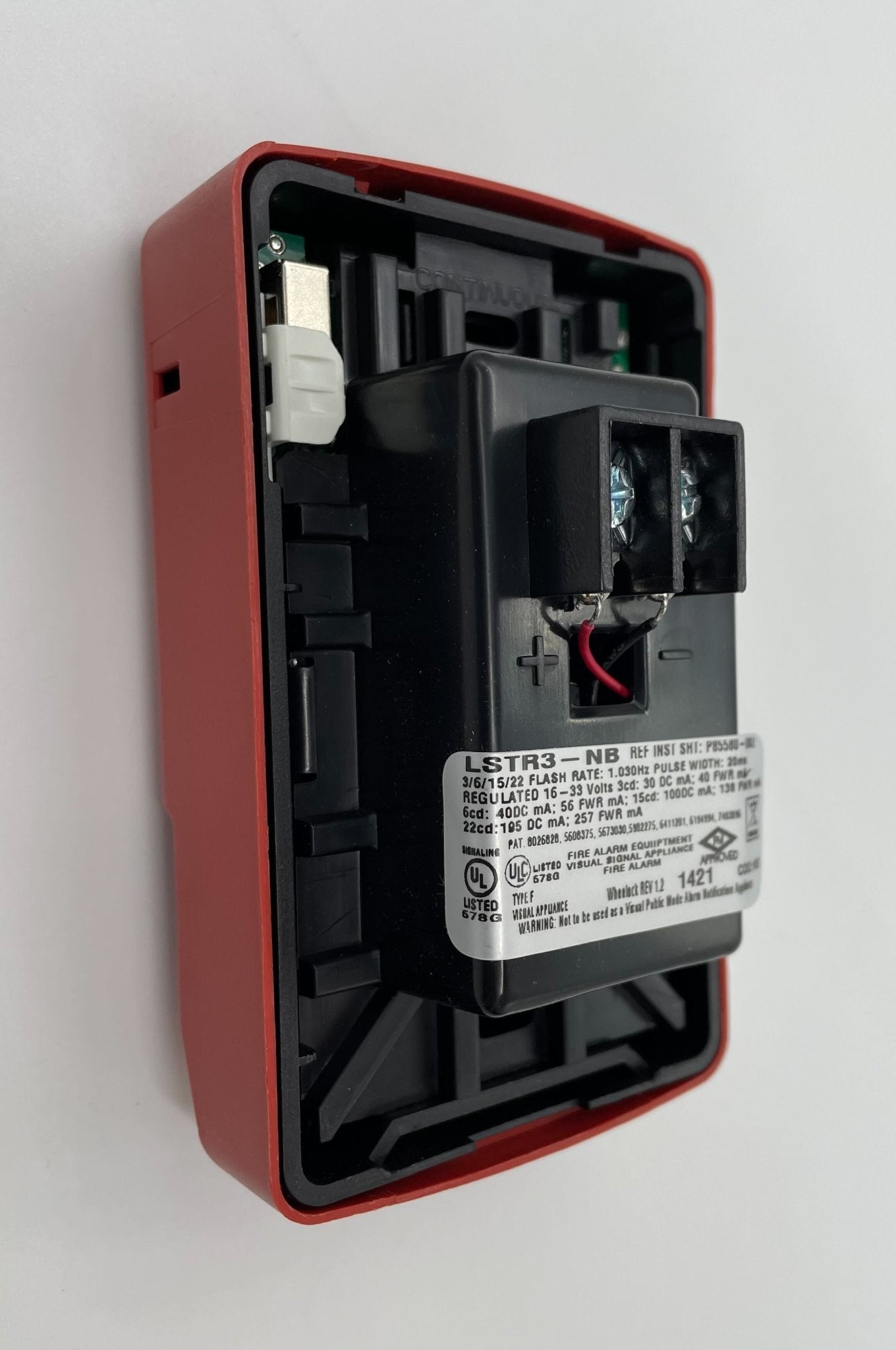 Eaton Wheelock LSTR3-NB strobe light with white housing and clear lens, designed for emergency warning and signaling.
