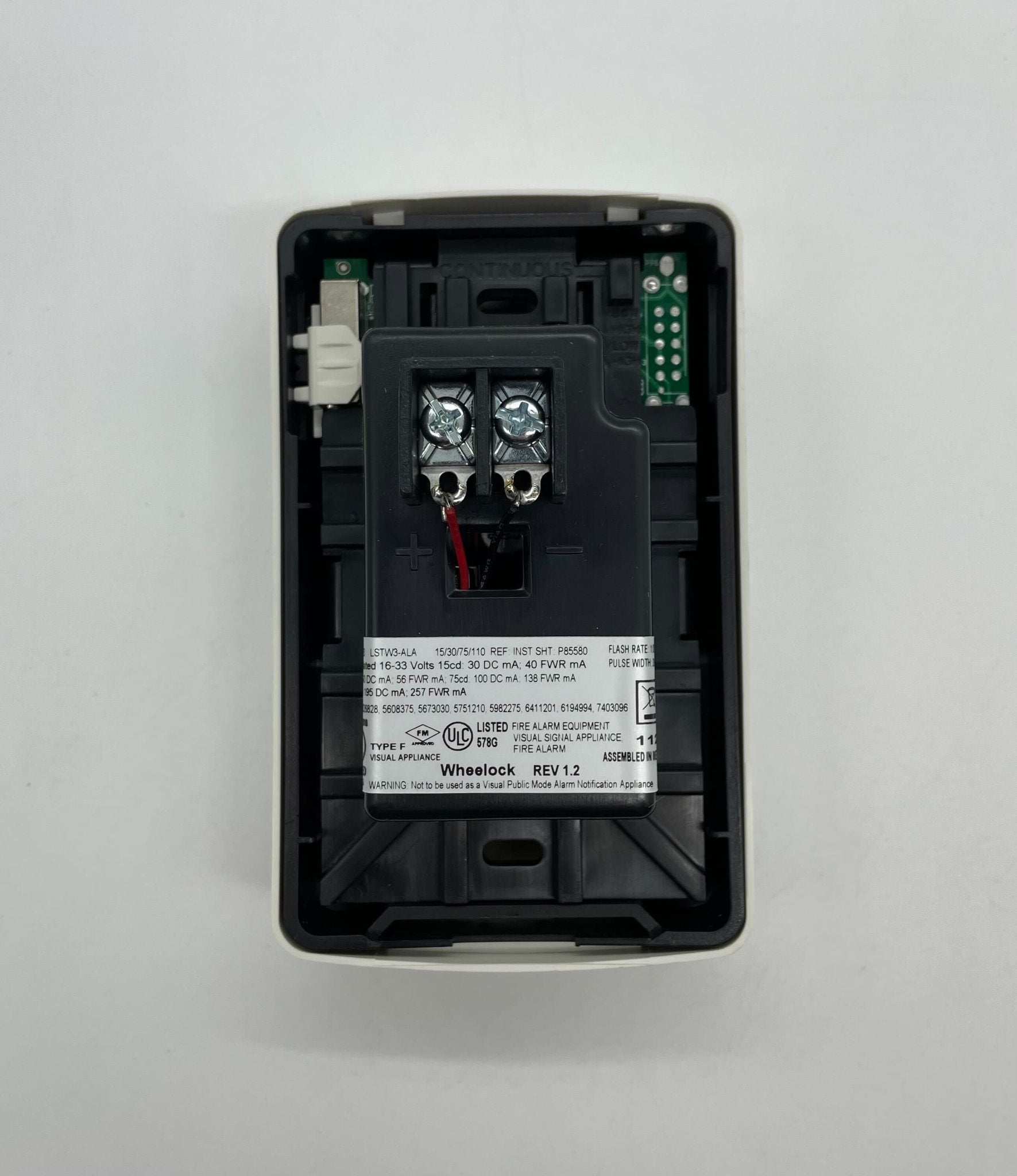 Eaton Wheelock LSTW3-ALA strobe light with clear lens and mounting bracket, designed for emergency warning systems.