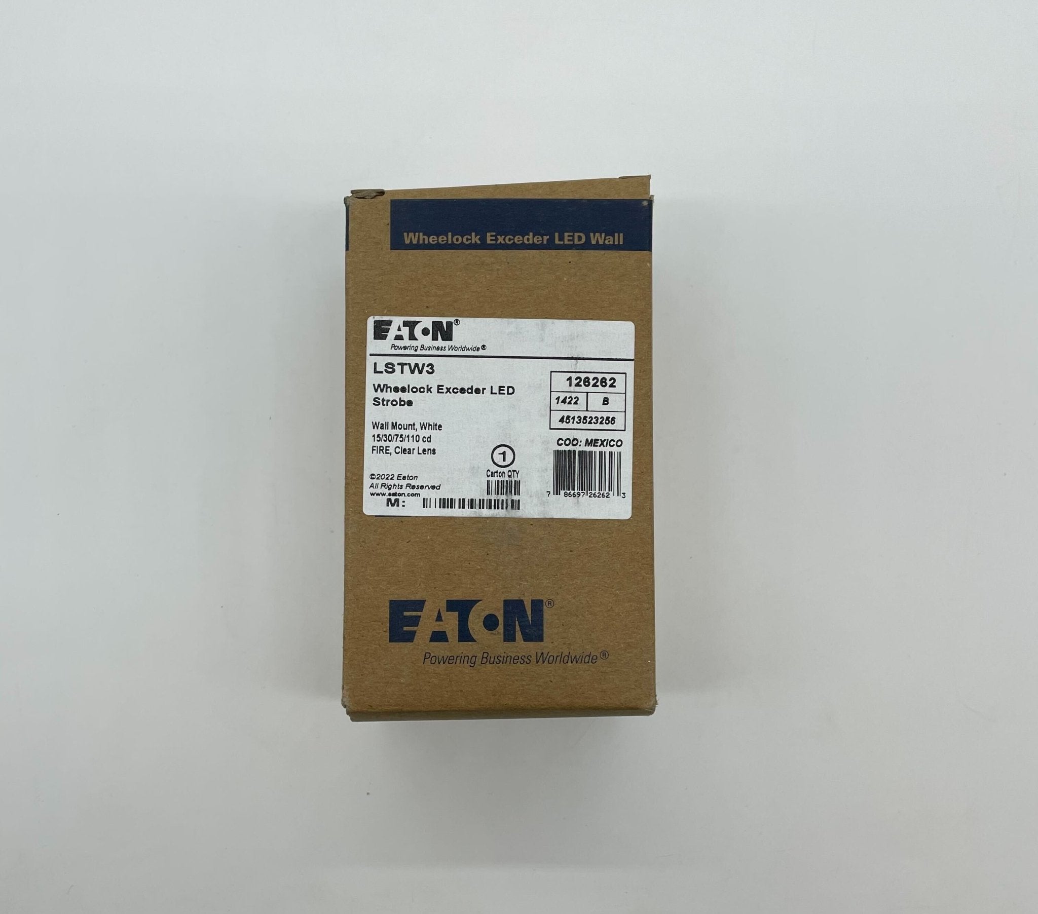 Eaton Wheelock LSTW3 strobe light with clear lens and mounting bracket, designed for emergency signaling and alert systems.