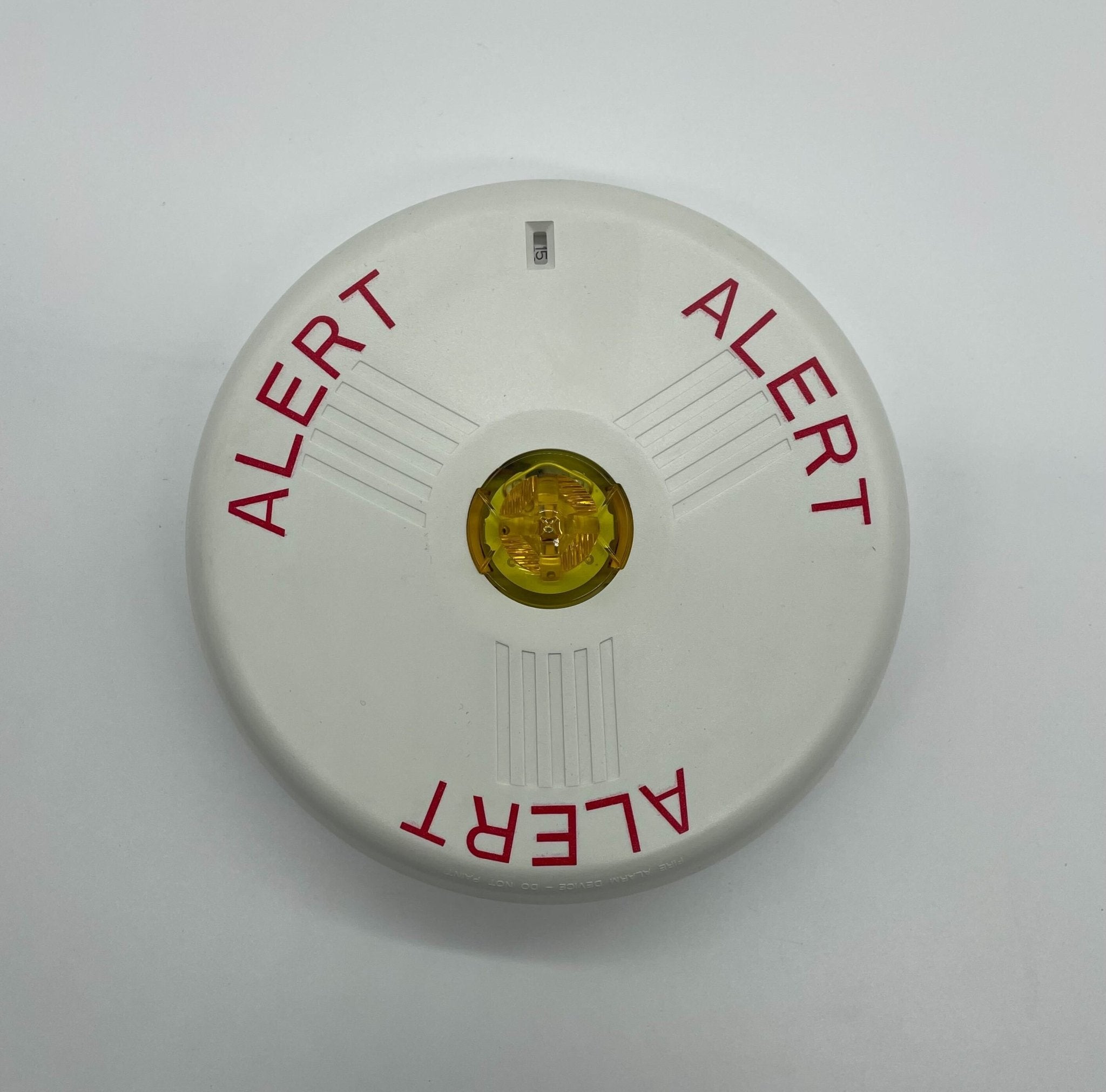 Eaton Wheelock LSTWC3-ALA strobe light with clear lens and mounting bracket, designed for emergency signaling and safety applications.