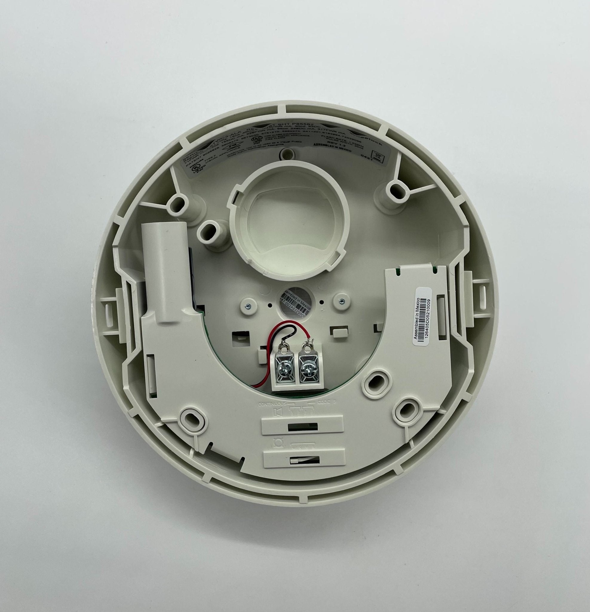 Eaton Wheelock LSTWC3-ALA strobe light with clear lens and mounting bracket, designed for emergency signaling and safety applications