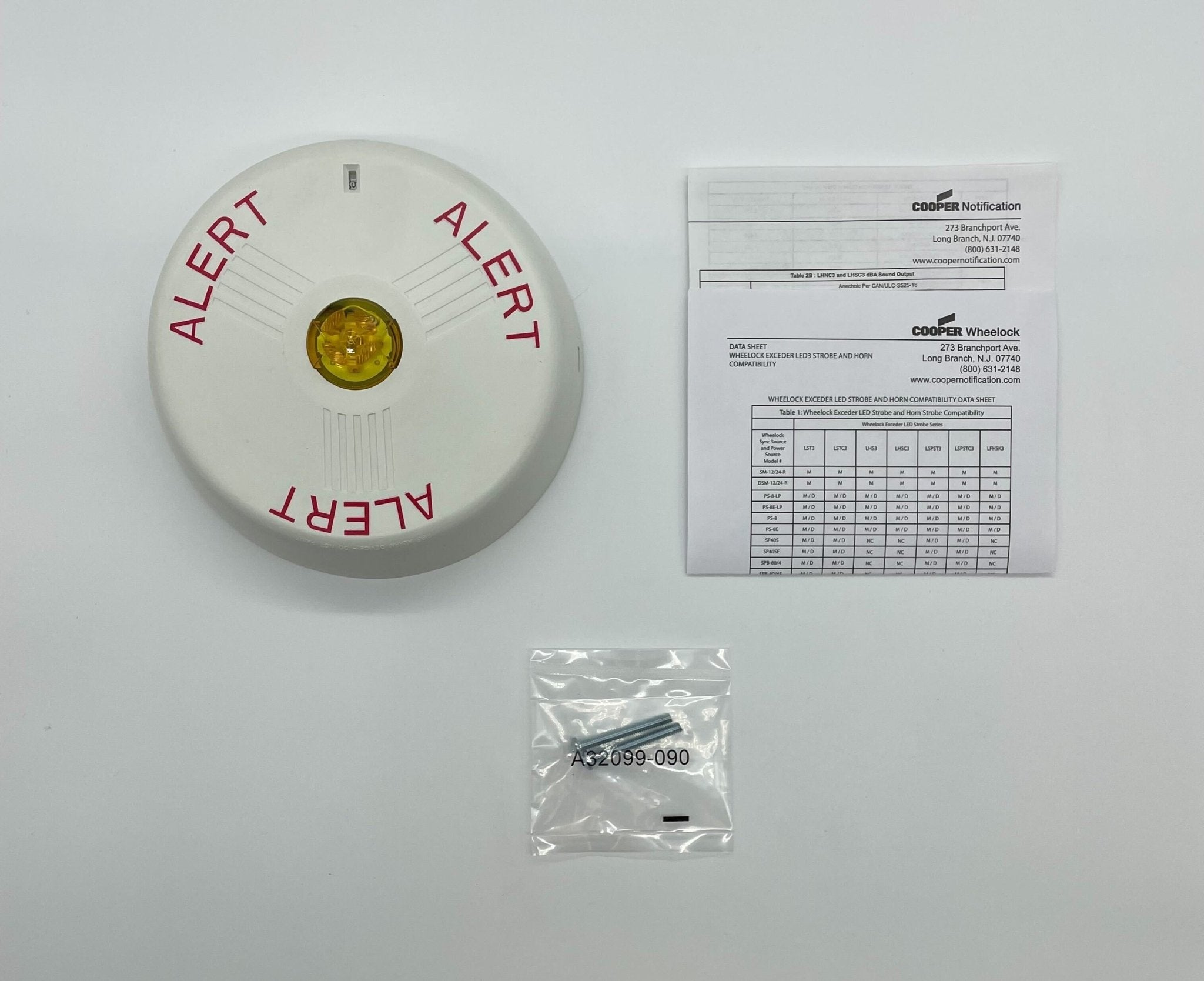 Eaton Wheelock LSTWC3-ALA strobe light with clear lens and mounting bracket, designed for emergency signaling and alert systems.