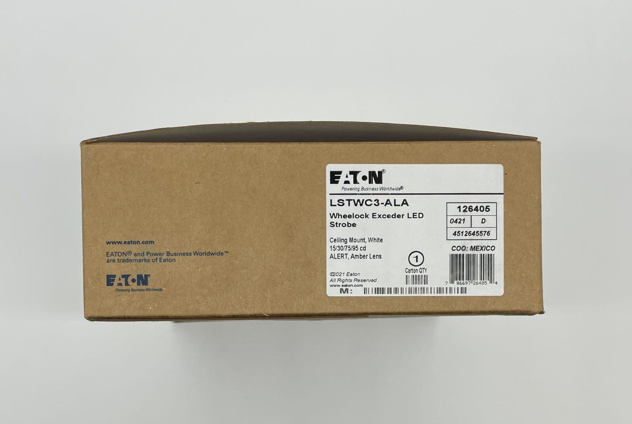 Eaton Wheelock LSTWC3-ALA strobe light with clear lens and mounting bracket, designed for emergency warning systems