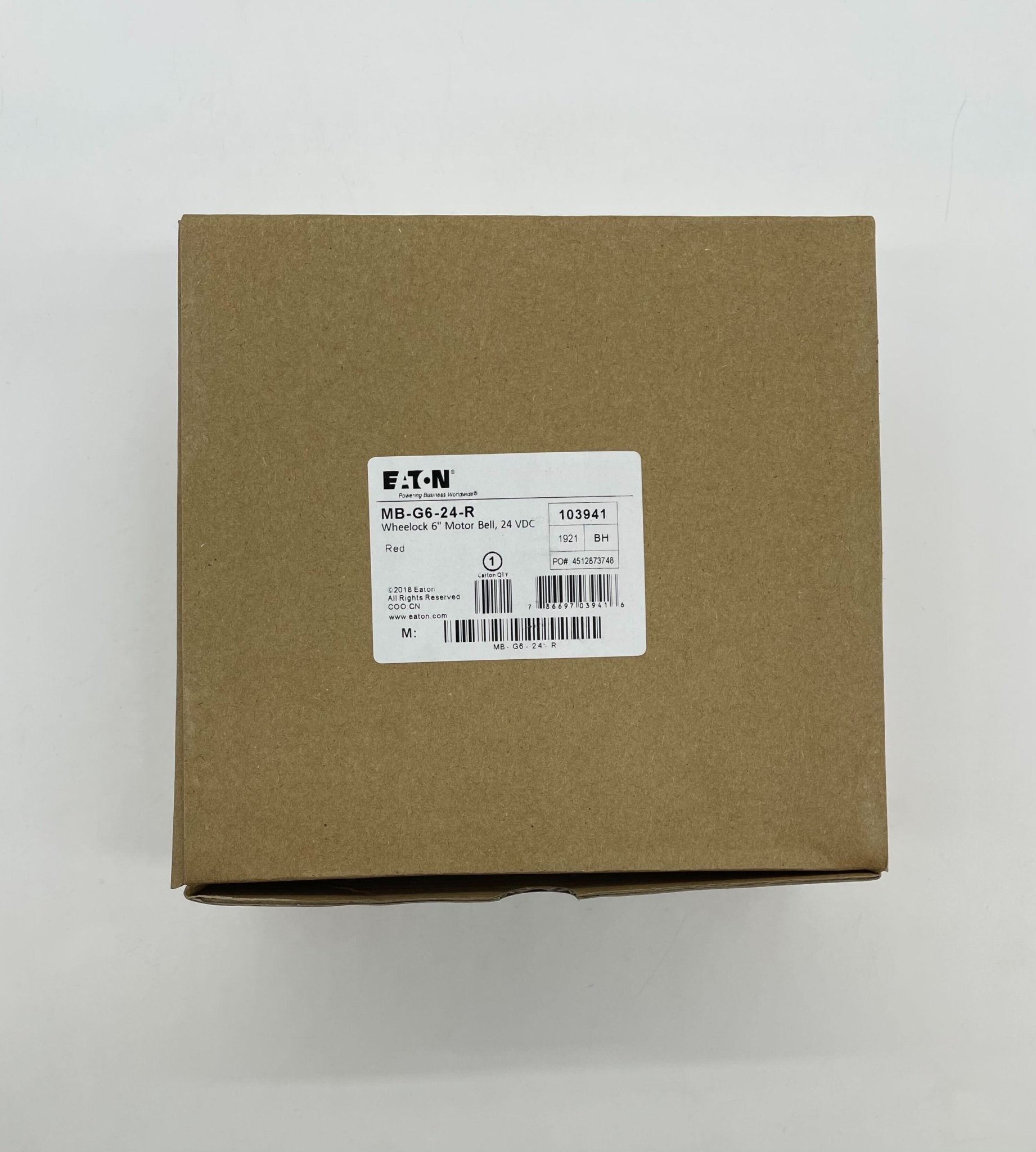 Eaton Wheelock MB-G6-24-R bell with metal housing and mounting bracket, designed for commercial signaling applications
