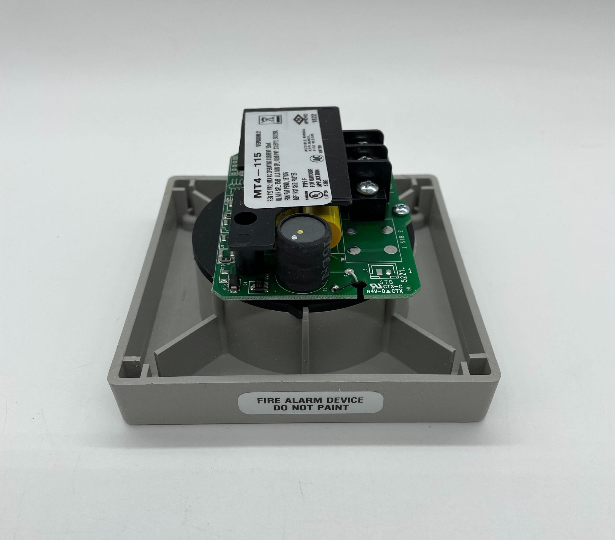 Eaton Wheelock MT4-115-S fire alarm with mounting hardware, designed for fire safety and emergency alert systems.