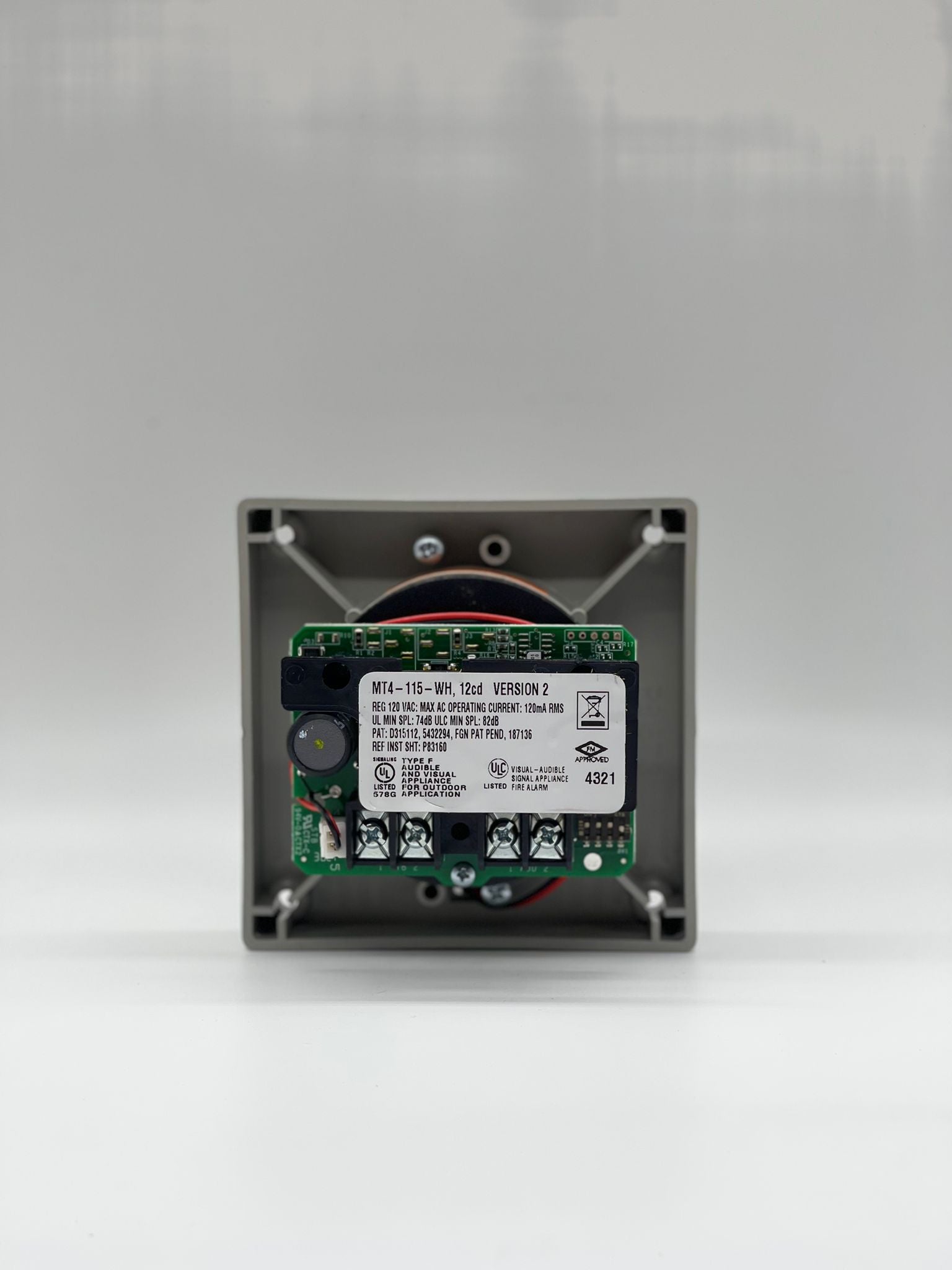 Eaton Wheelock MT4-115-WH-VFR strobe light with white housing, mounted on a ceiling for emergency signaling.