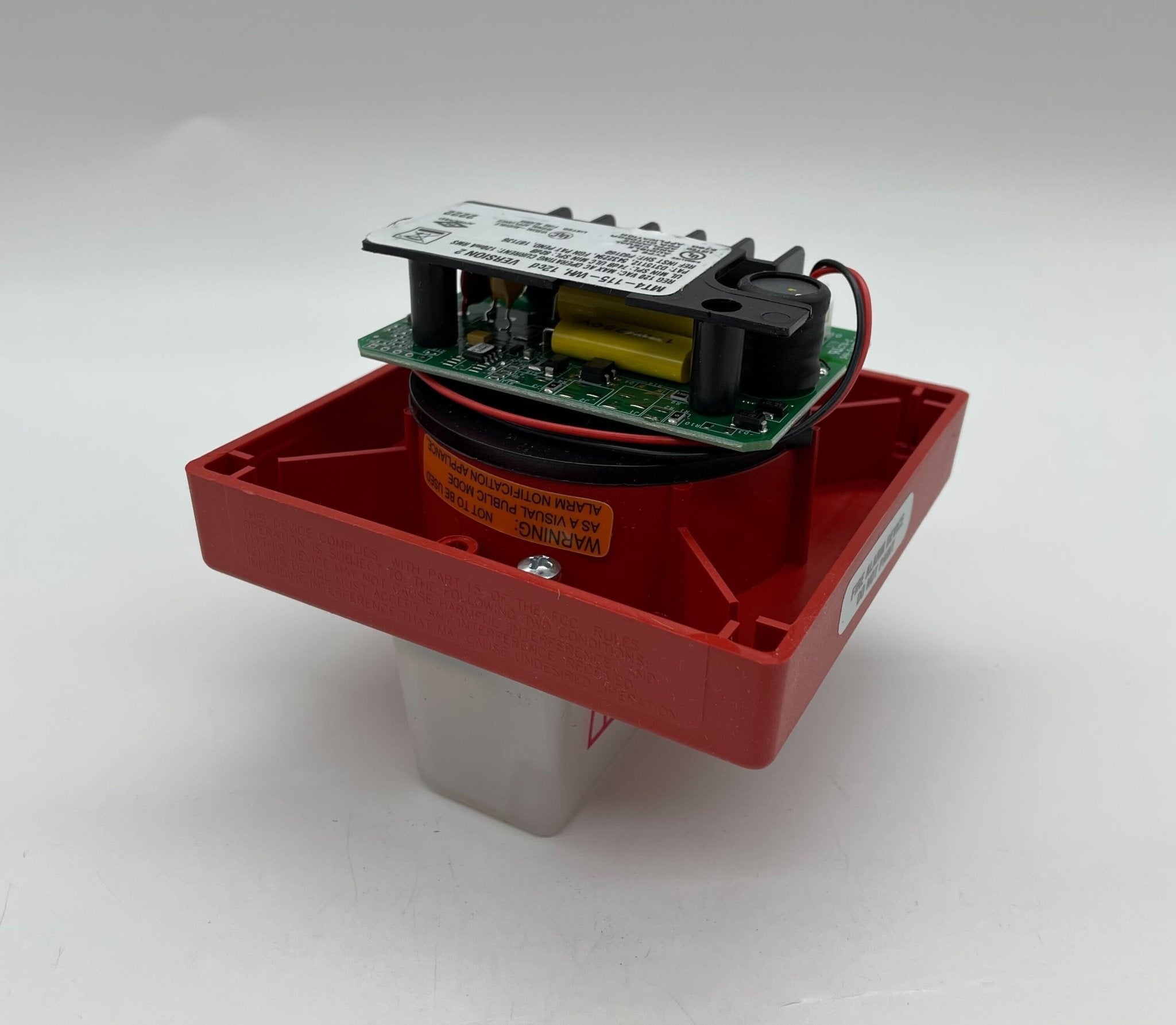 Eaton Wheelock MT4-115-WH-VFR strobe light with white housing, mounted on a wall for emergency signaling and visual alerting.