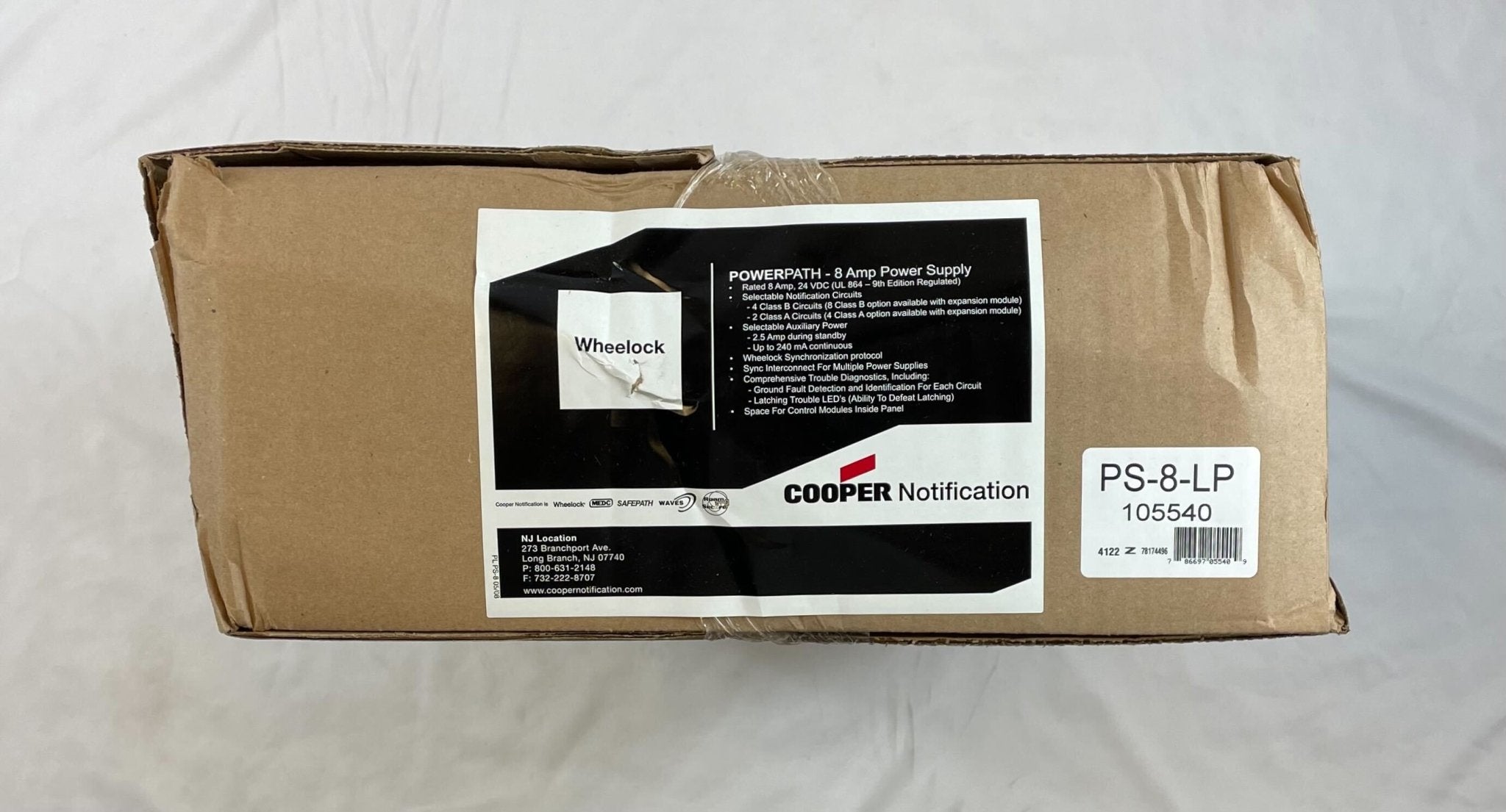 Eaton Wheelock PS-8-LP power supply unit with electrical connections for fire alarm systems.
