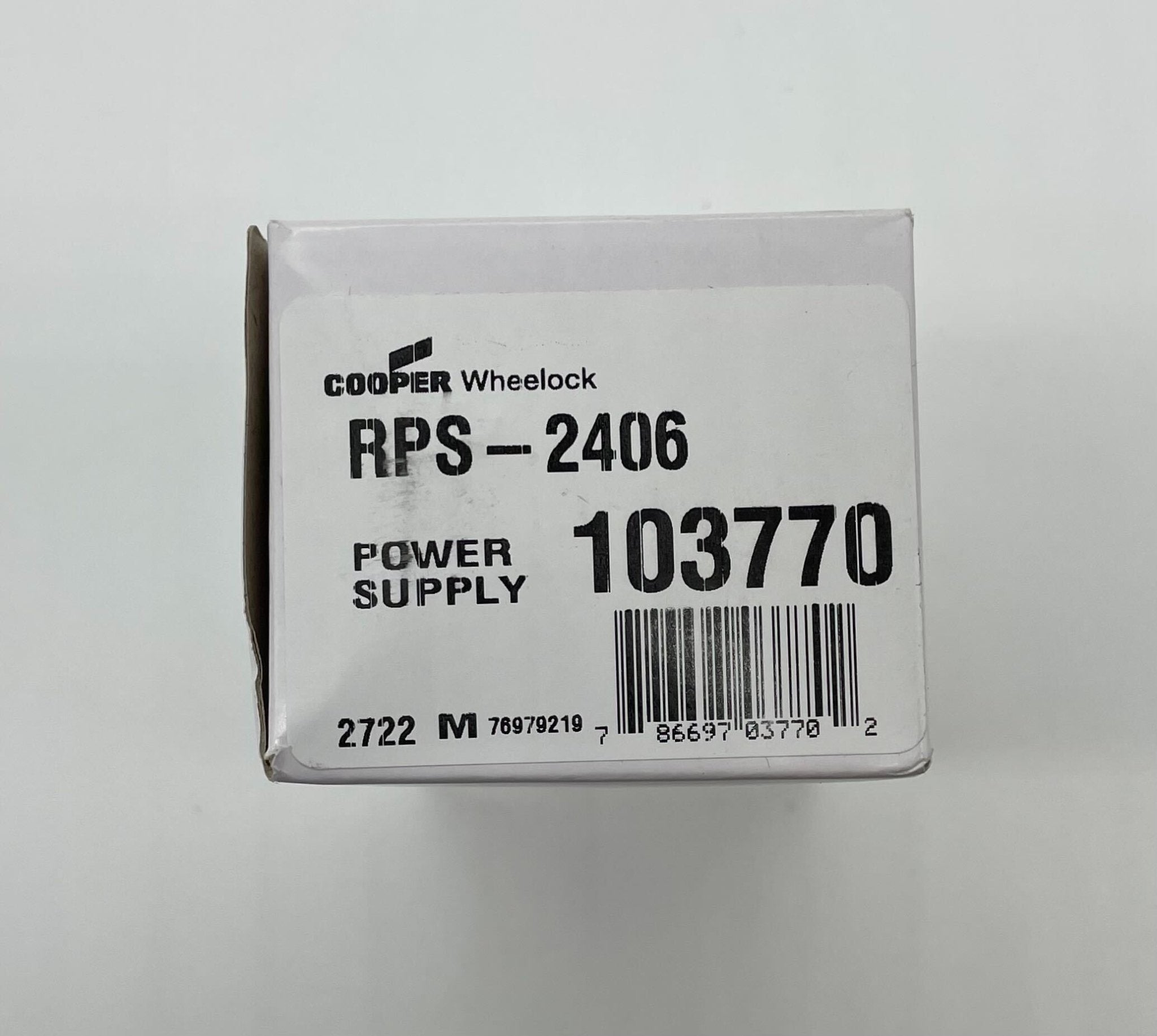 Eaton Wheelock RPS-2406 power supply with multiple ports, mounted on a circuit board for electronic systems.