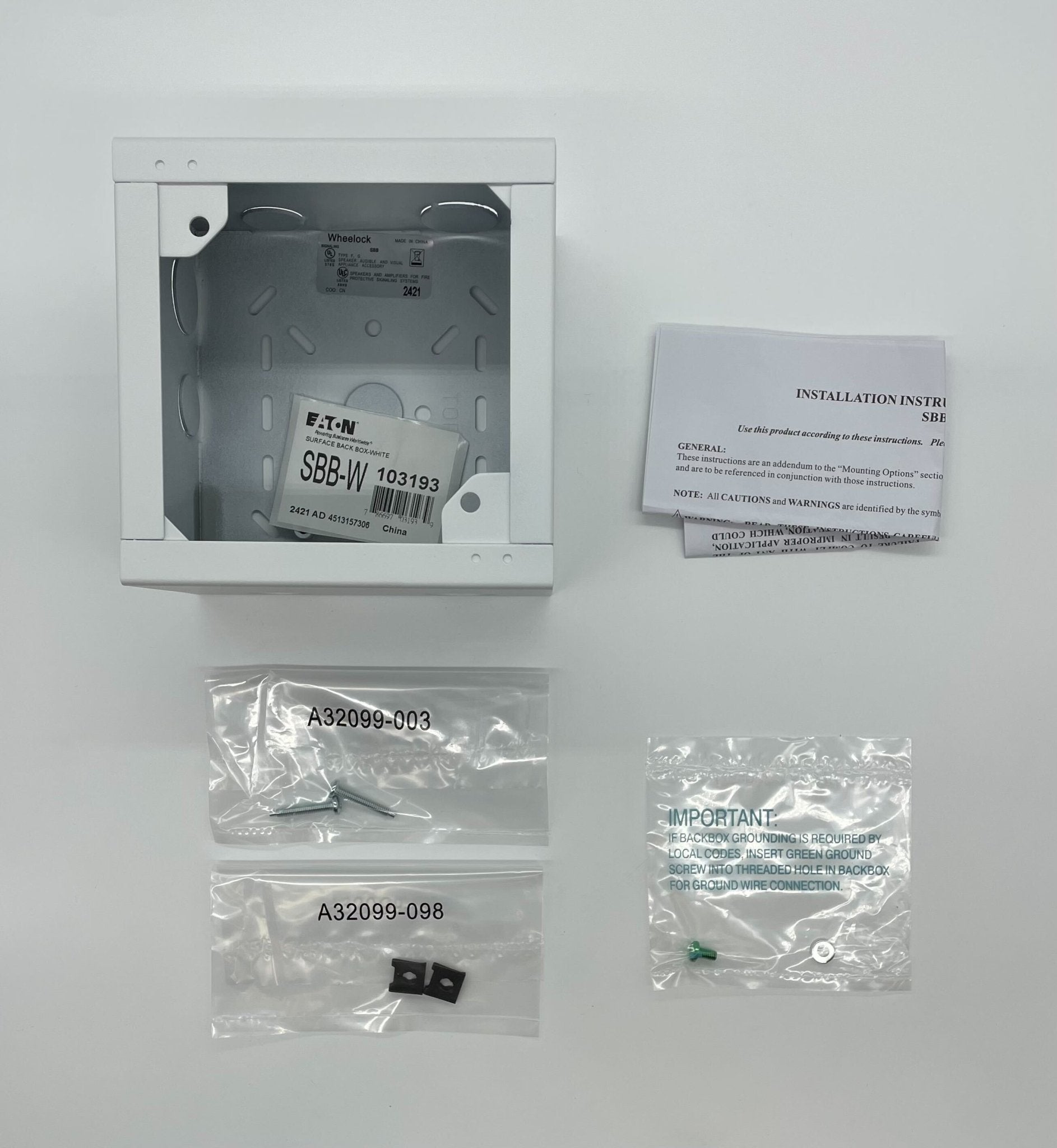 Eaton Wheelock SBB-W backbox for electrical wiring, shown in a close-up view with mounting details and product branding.