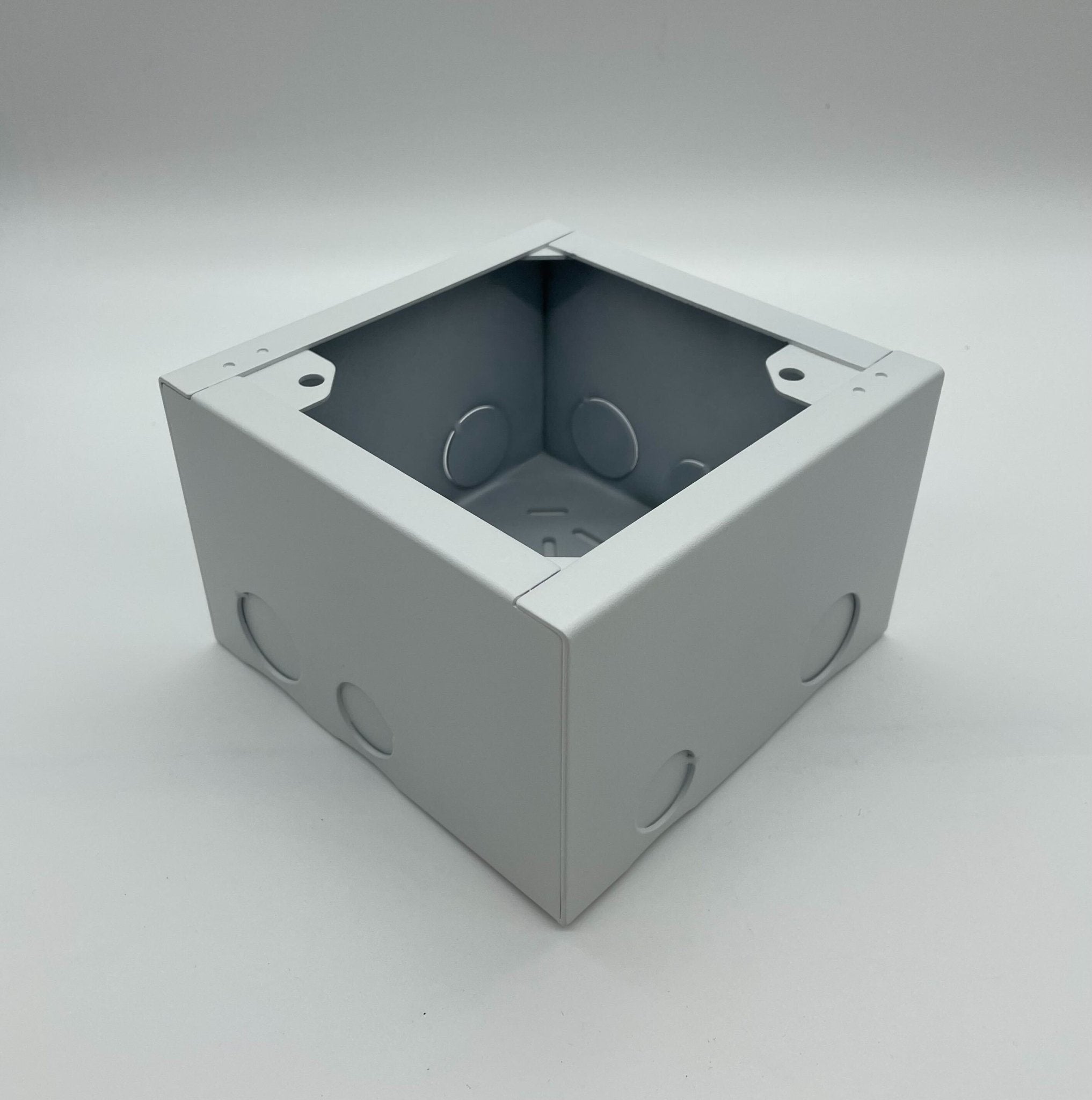 Eaton Wheelock SBB-W backbox for electrical installations, shown in a professional setting with mounting hardware.