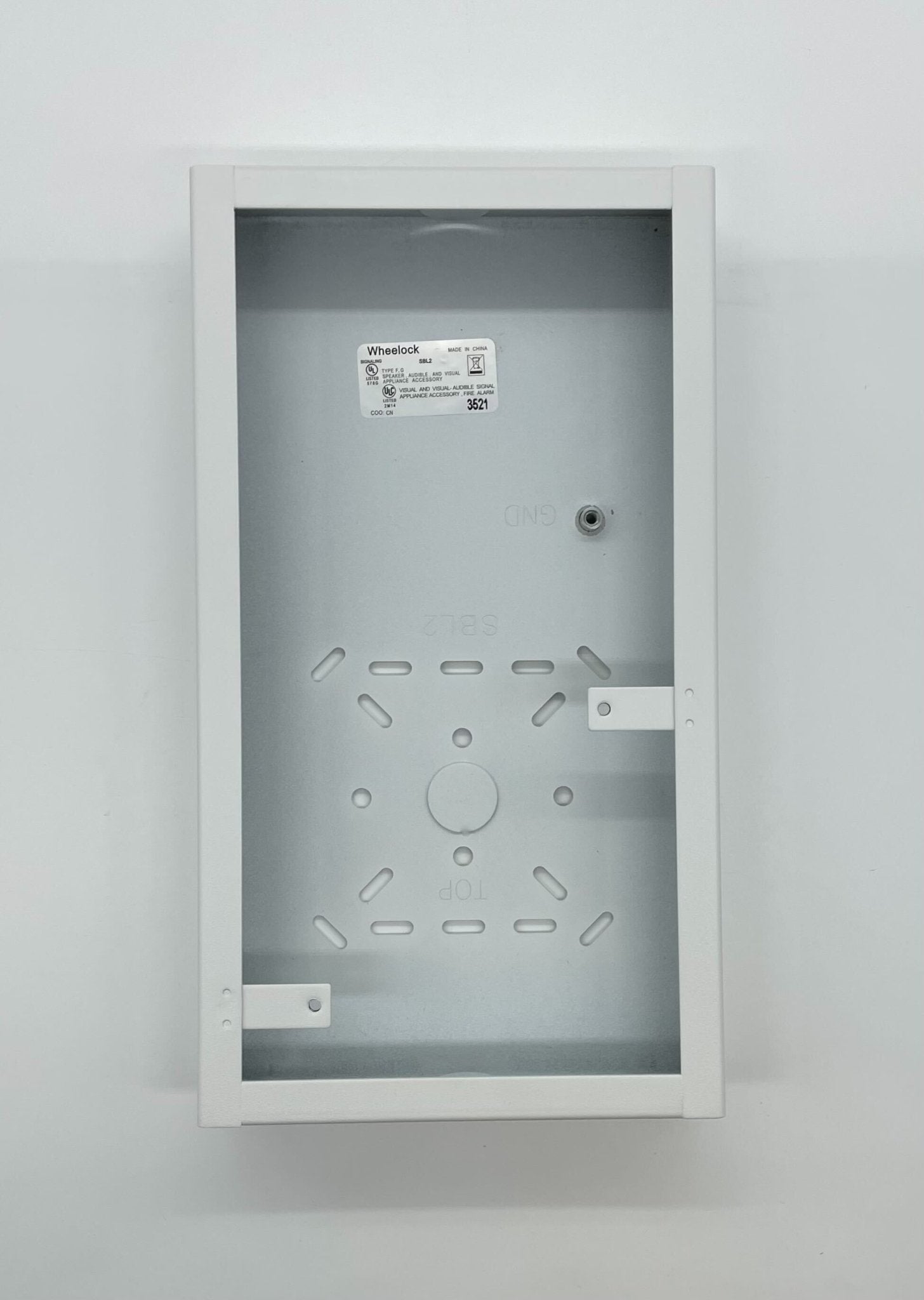 Eaton Wheelock SBL2-W backbox mounted on wall, showing its sturdy metal construction and sleek design for electrical installations.