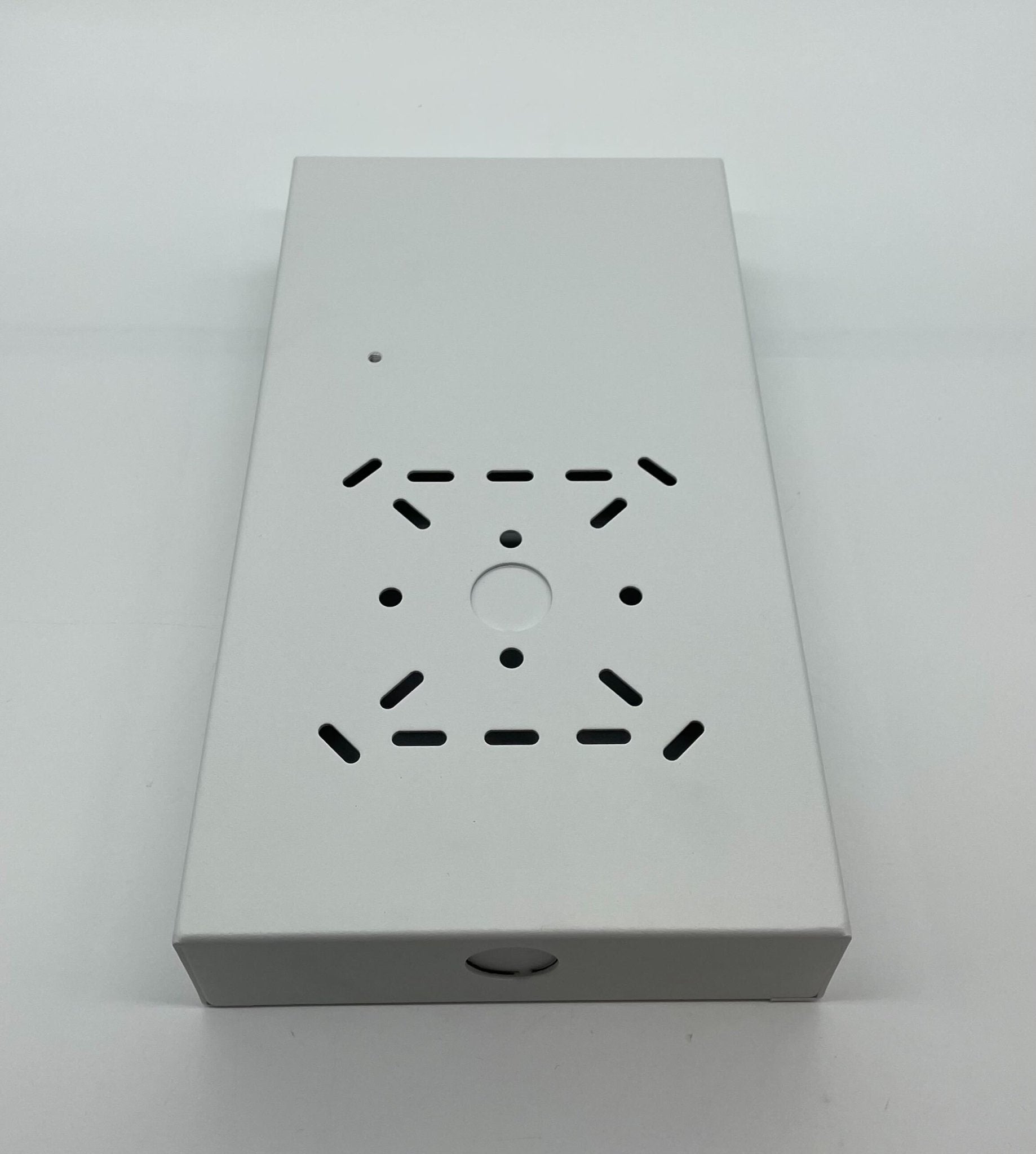 Eaton Wheelock SBL2-W backbox mounted on wall, made of durable metal, with a rectangular shape and open front design.