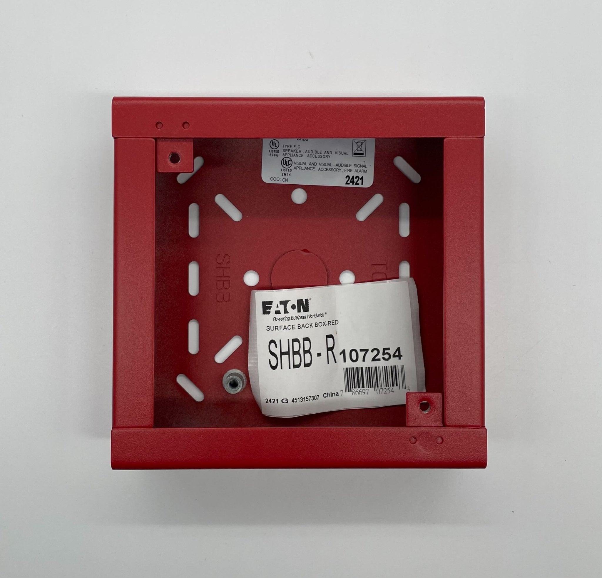 Eaton Wheelock SHBB-R backbox for electrical systems, shown in a close-up view of the metal enclosure with mounting features.