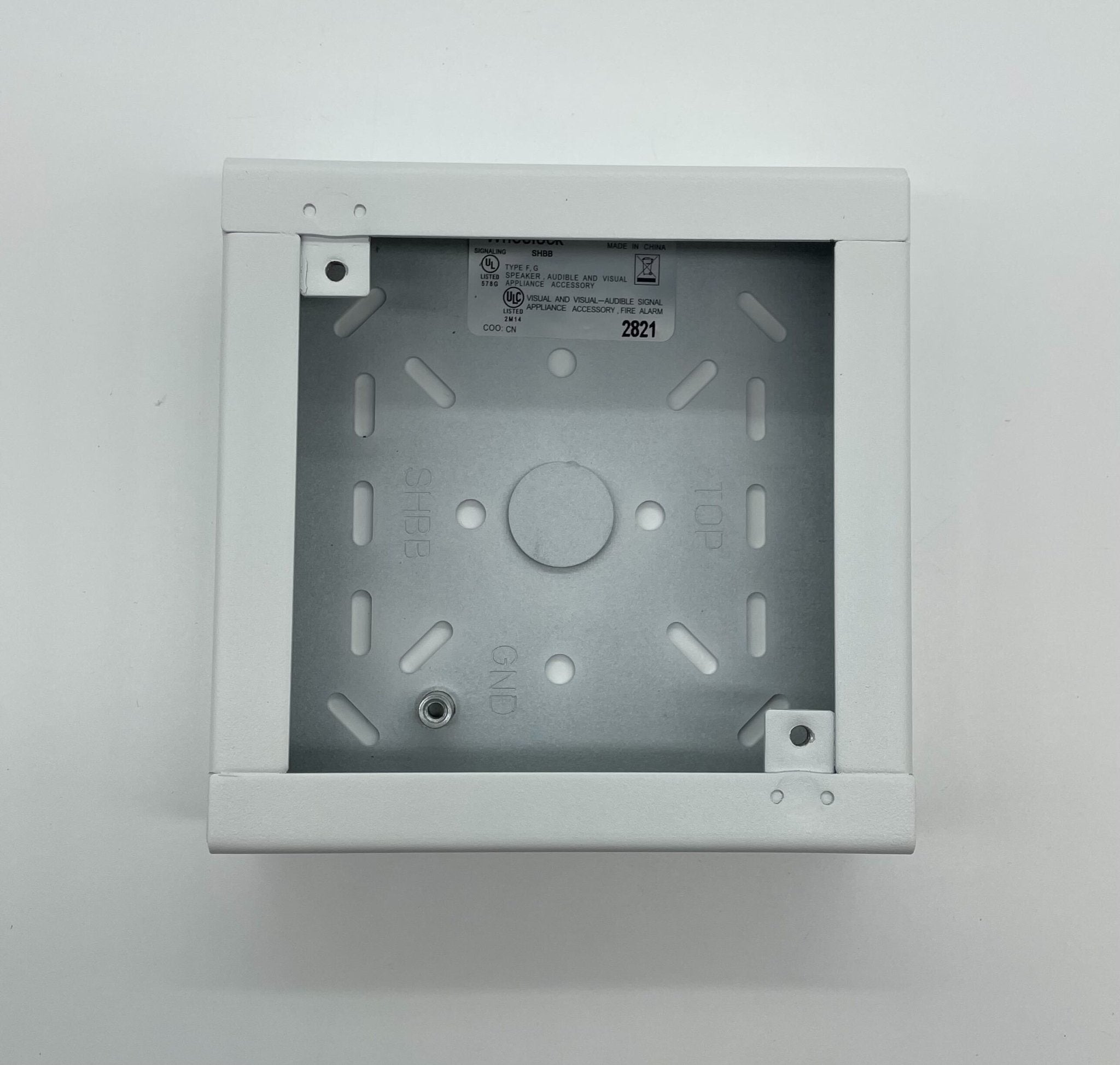 Eaton Wheelock SHBB-W backbox for electrical installations, shown in a close-up view with mounting features and brand markings.