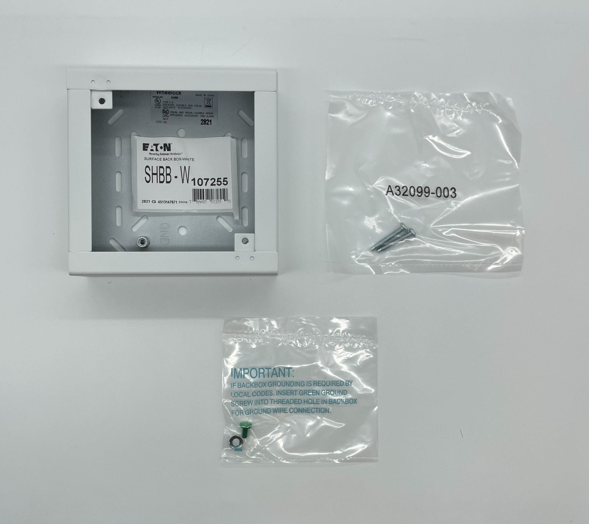 Eaton Wheelock SHBB-W backbox mounted on wall, metal electrical enclosure for wiring and device installations.
