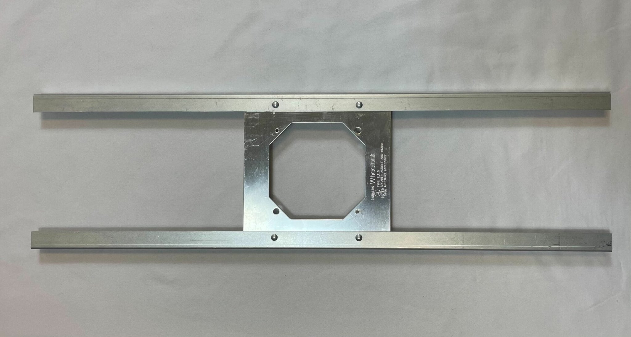 Eaton Wheelock SSB-4 speakers, black rectangular enclosure with mounting brackets, designed for audio installations.