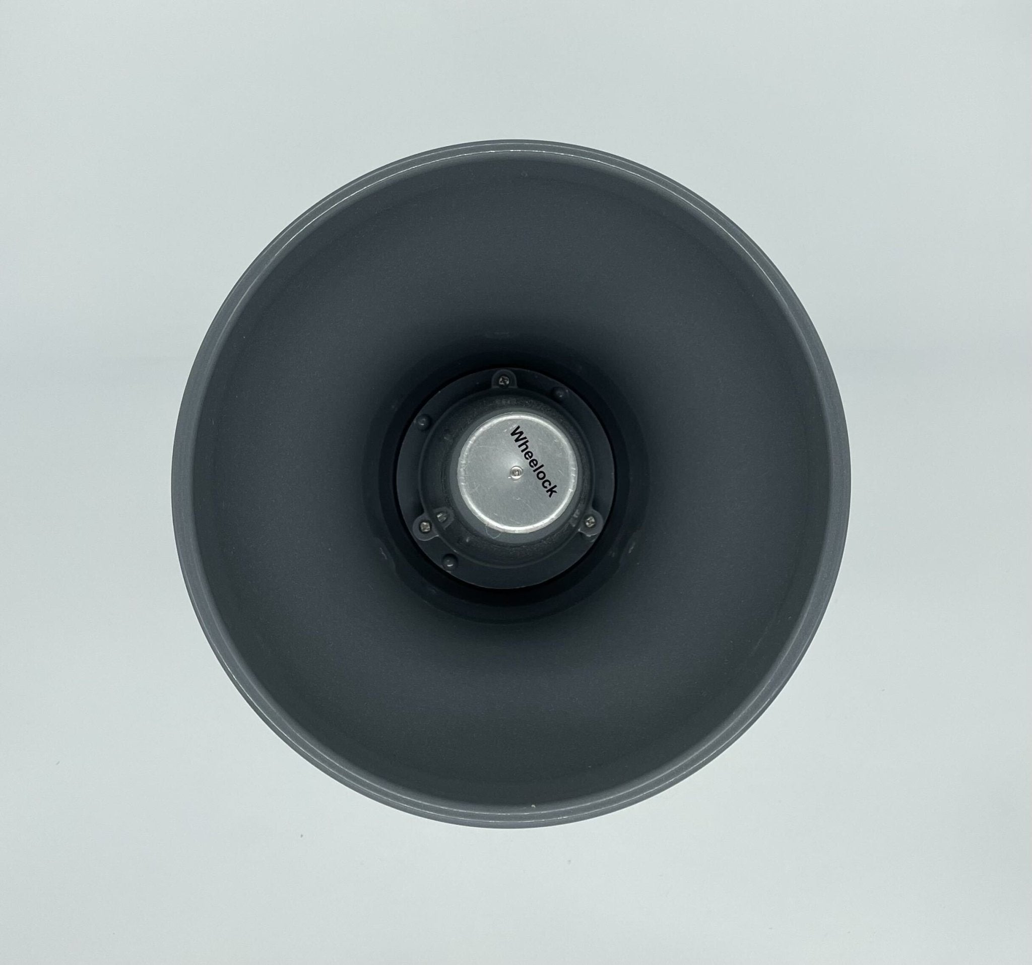 Eaton Wheelock STH-15S horn with metal mounting bracket and wiring connections, designed for industrial signaling systems.
