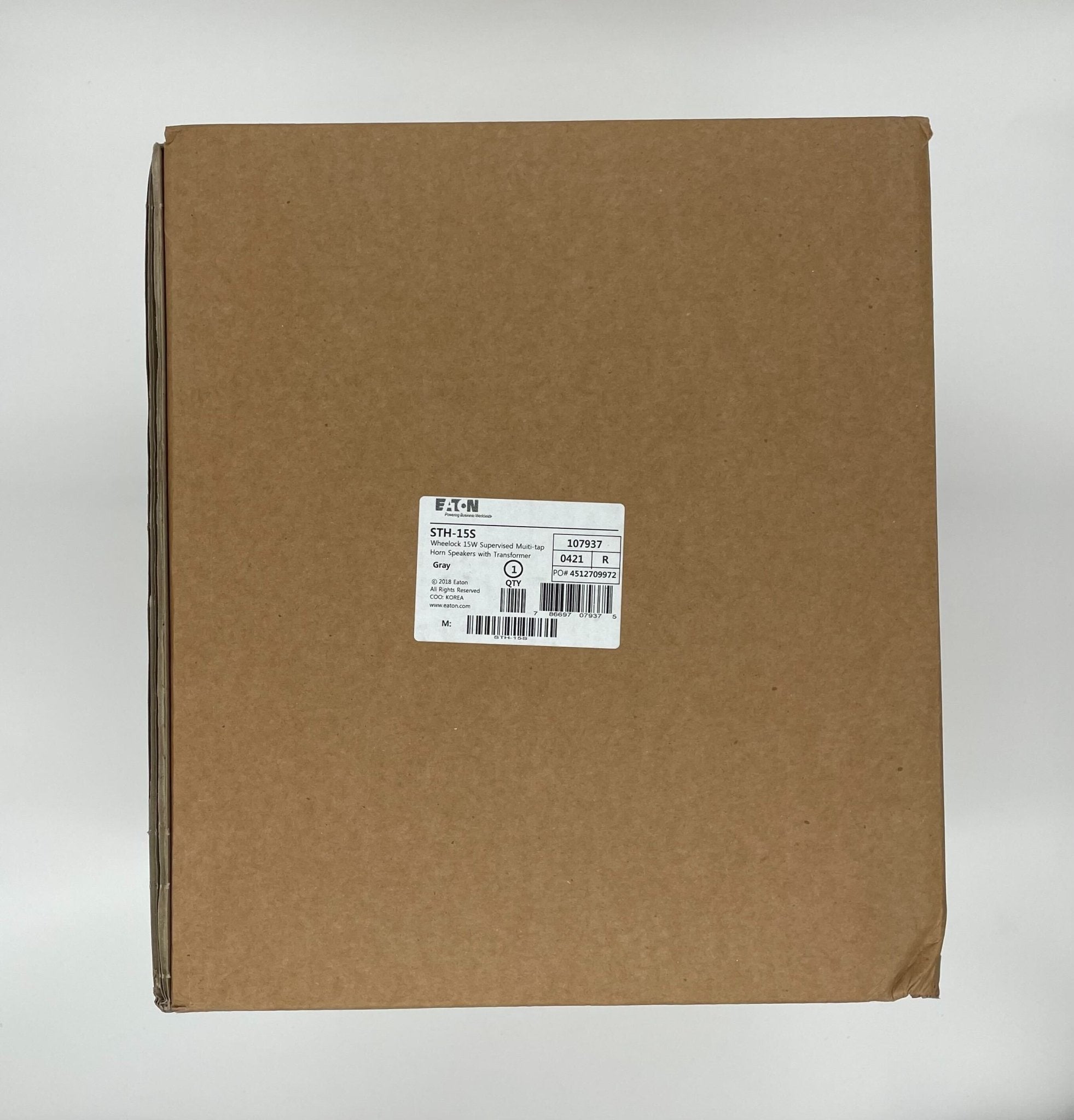 Eaton Wheelock STH-15S horn, black metal with mounting bracket, designed for industrial or emergency alert systems.