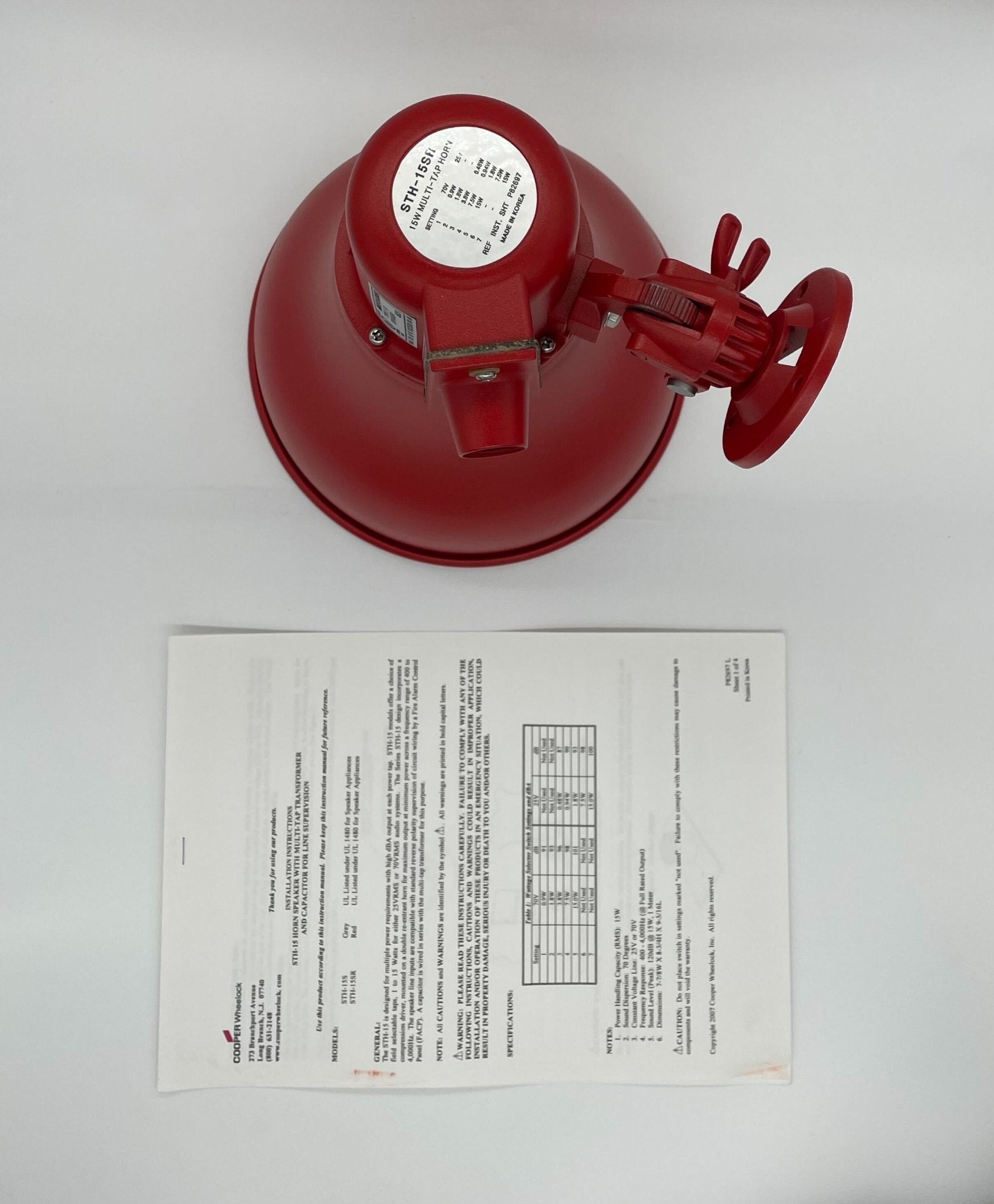 Eaton Wheelock STH-15SR horn with metal mounting bracket, designed for alert and warning applications.