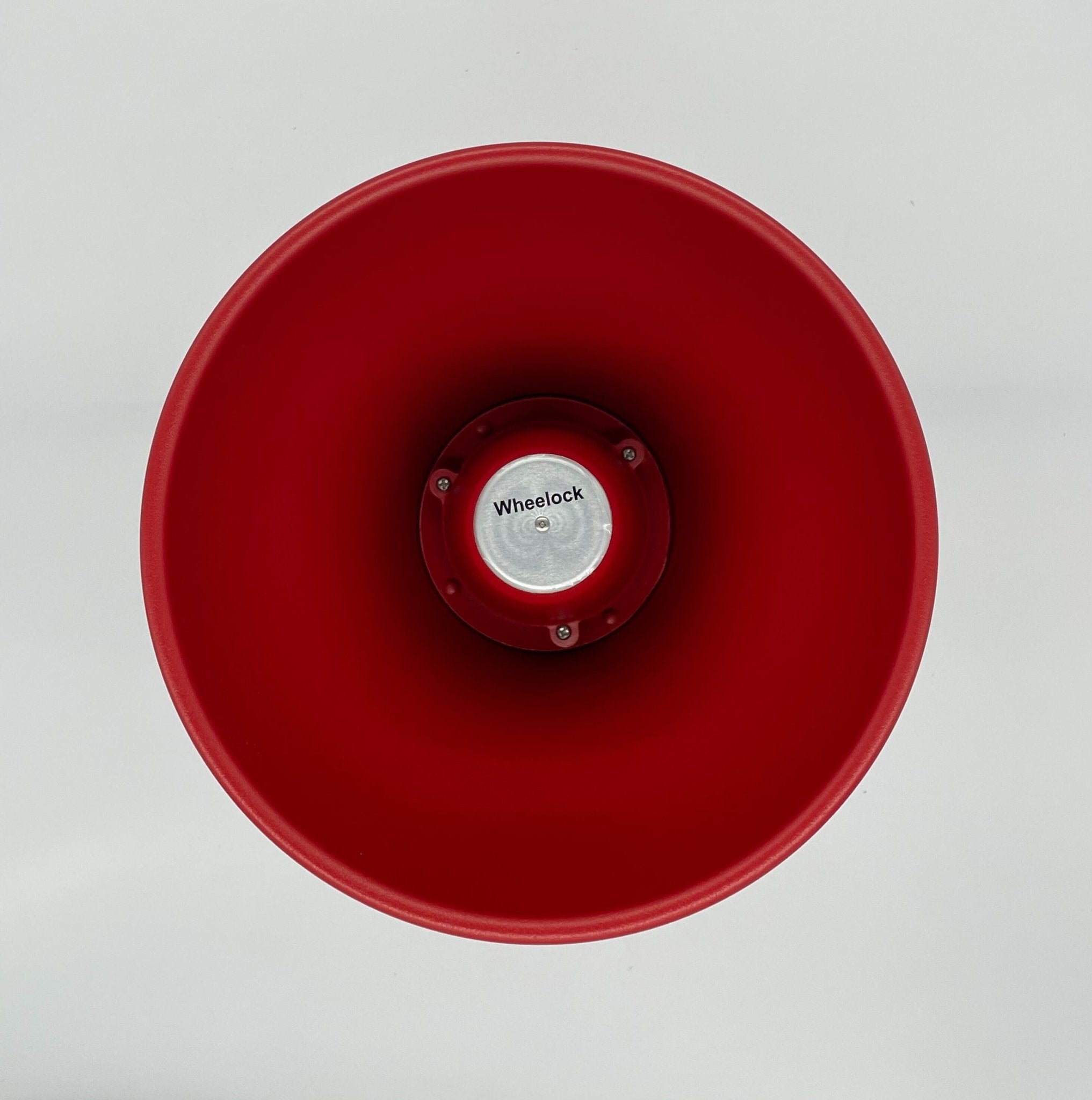 Eaton Wheelock STH-15SR horns, yellow and black, mounted on a metal surface, used for industrial or emergency signaling.