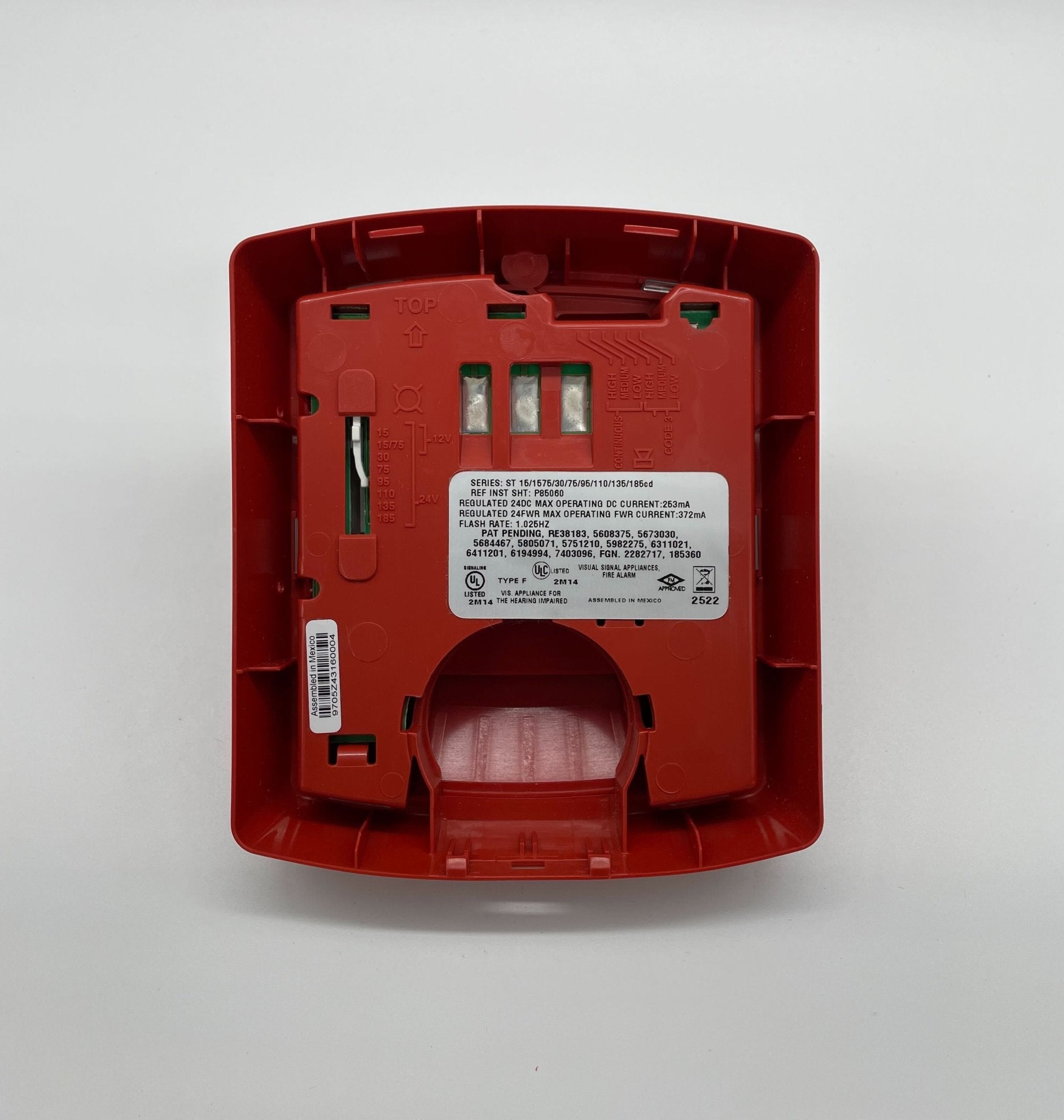 Eaton Wheelock STR-N strobe light, mounted on a wall, with clear lens and industrial design for visual signaling.