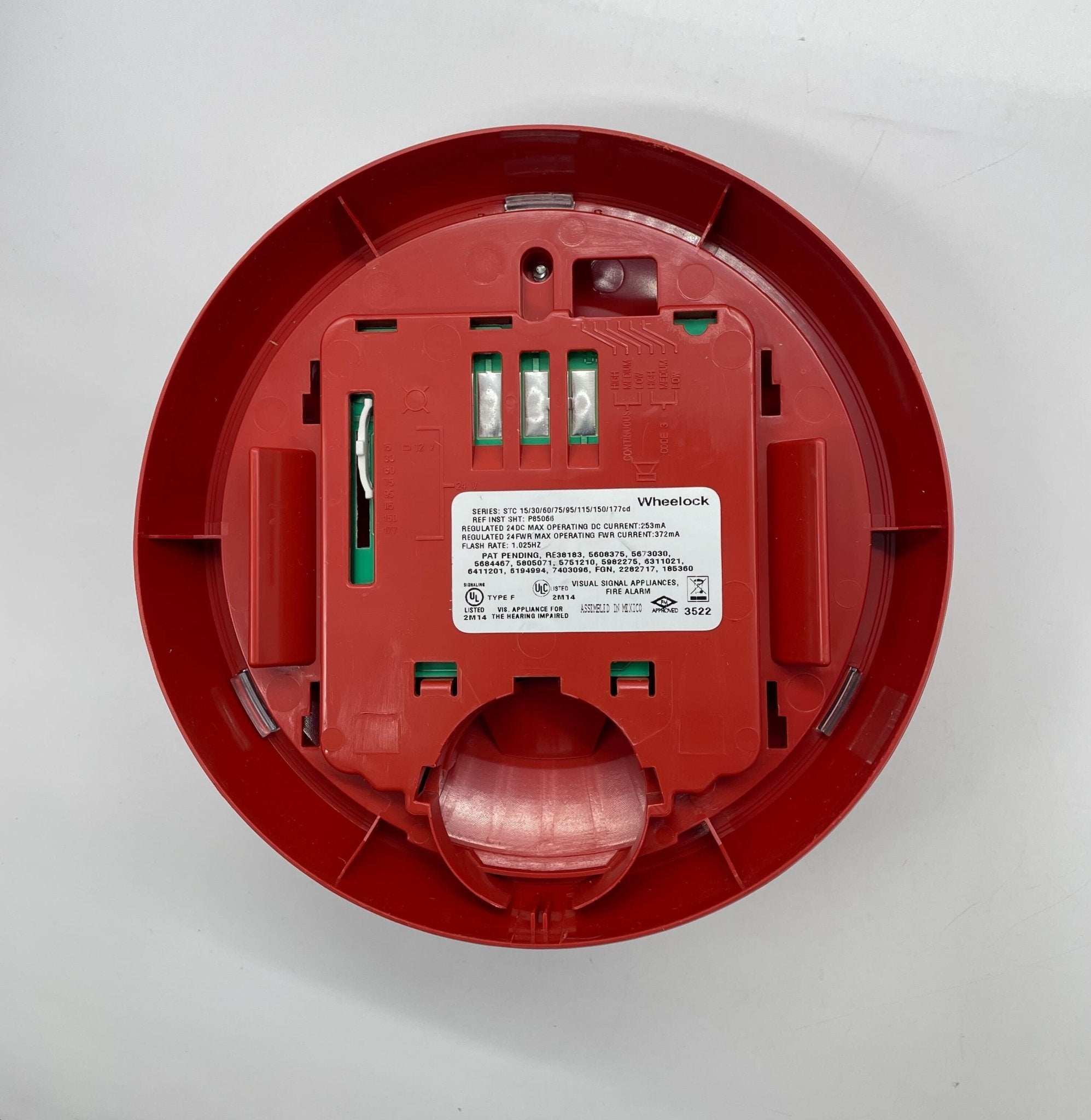 Eaton Wheelock STRC-AL strobe light with aluminum housing, mounted on a ceiling, for emergency signaling and alert systems.