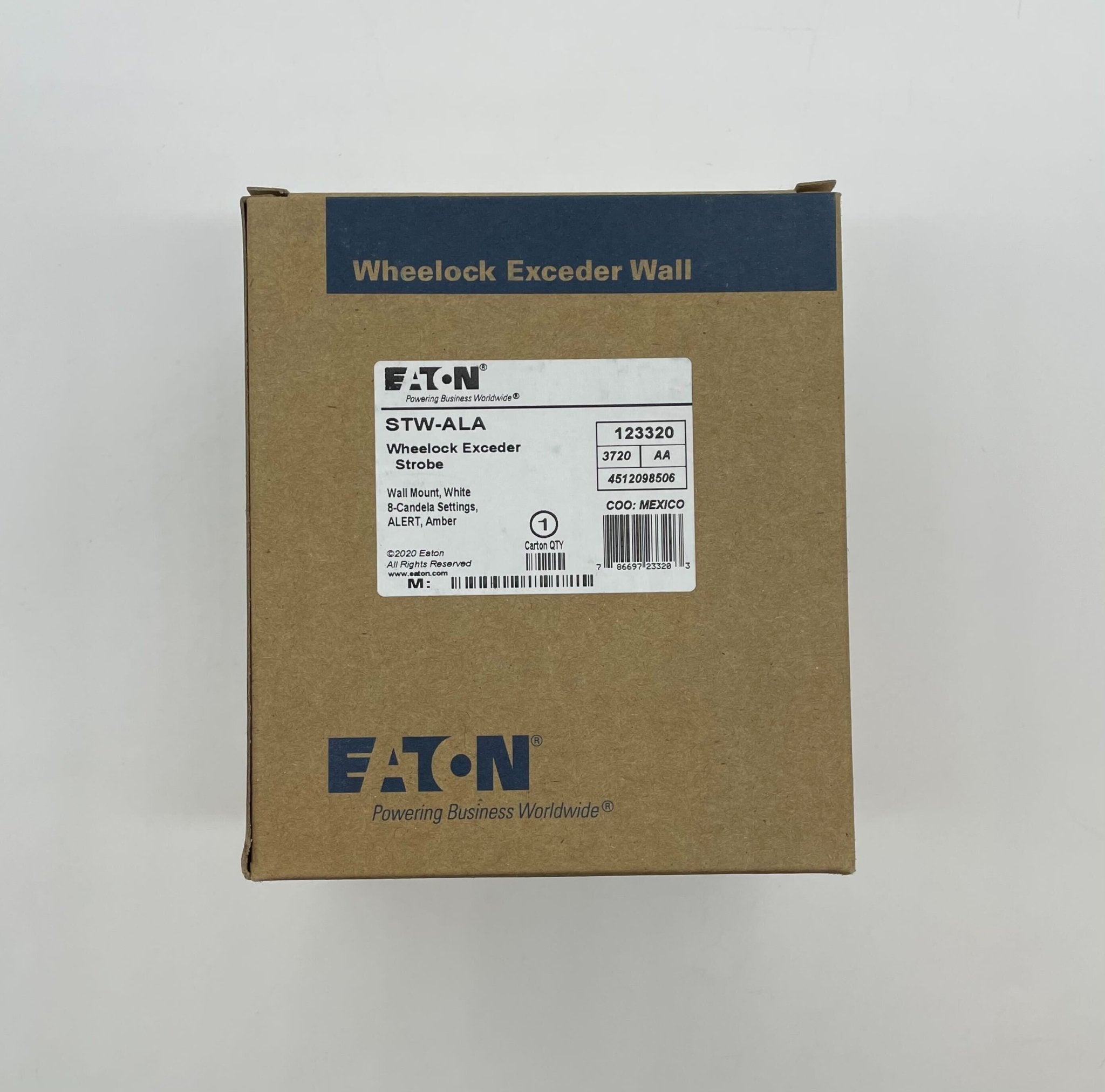 Eaton Wheelock STW-ALA strobe light with clear lens and mounting bracket, designed for emergency signaling and alert systems.