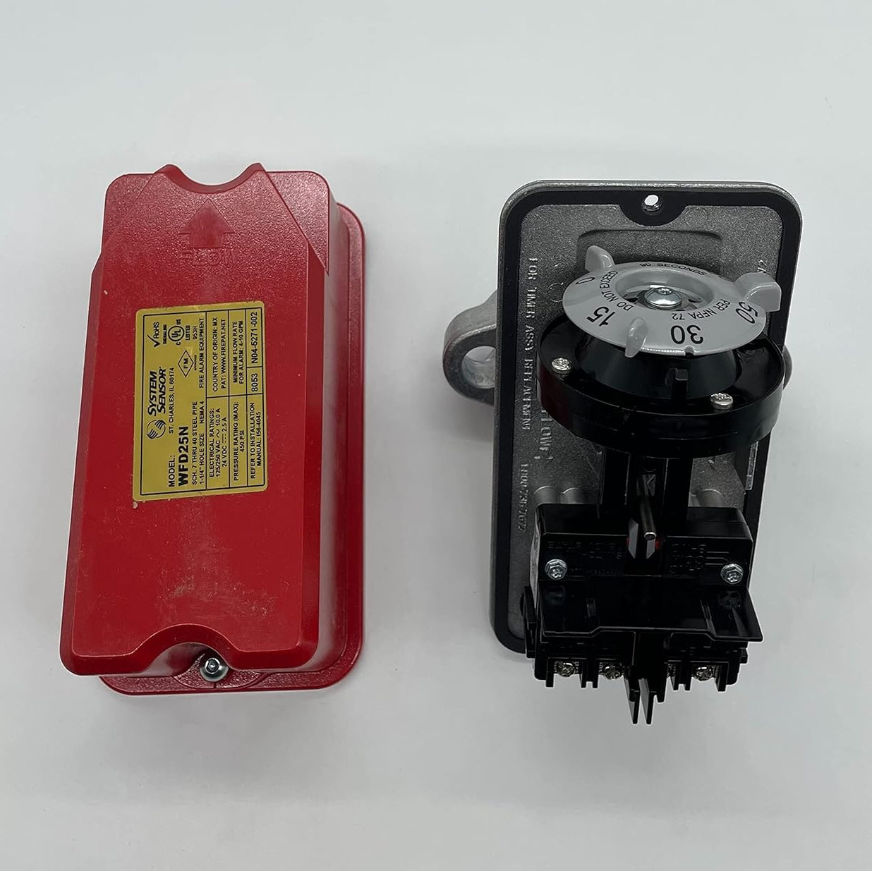 System Sensor WFD25N fire alarm with digital display and test button, mounted on a wall for fire detection and safety.