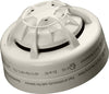 Apollo fire alarm sensor with ULC marking, mounted on ceiling, featuring a round design and detection components.