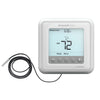 Resideo fire alarm sensor with wiring and mounting hardware, part of the Resideo TH6100AF2004/U fire alarm system.
