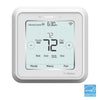 Resideo TH6220WF2006/U fire alarm sensor with digital display, mounted on a wall in a home safety setting
