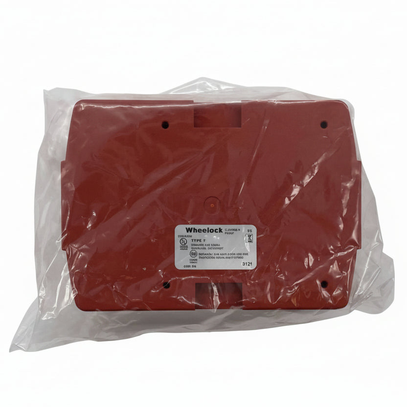 Eaton Wheelock ELSPKBB-R fire alarm with black cover and mounting base, designed for building safety systems