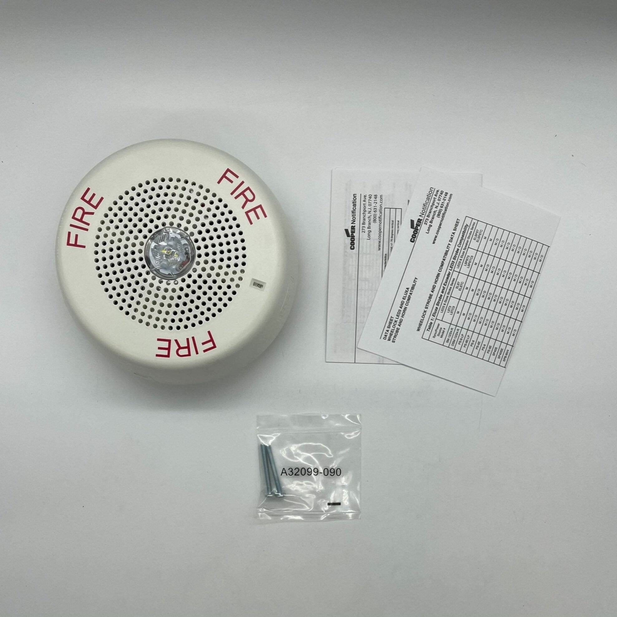 Eaton Wheelock LSPSTWC3 speaker strobe light in white, mounted on wall, for fire alarm signaling and emergency alerts.