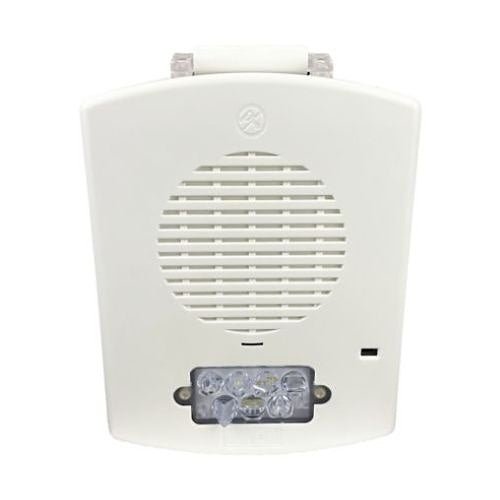 Eaton Wheelock EL4XMTST-FW fire alarm with stainless steel finish, mounted on wall, featuring alert indicator and control buttons.