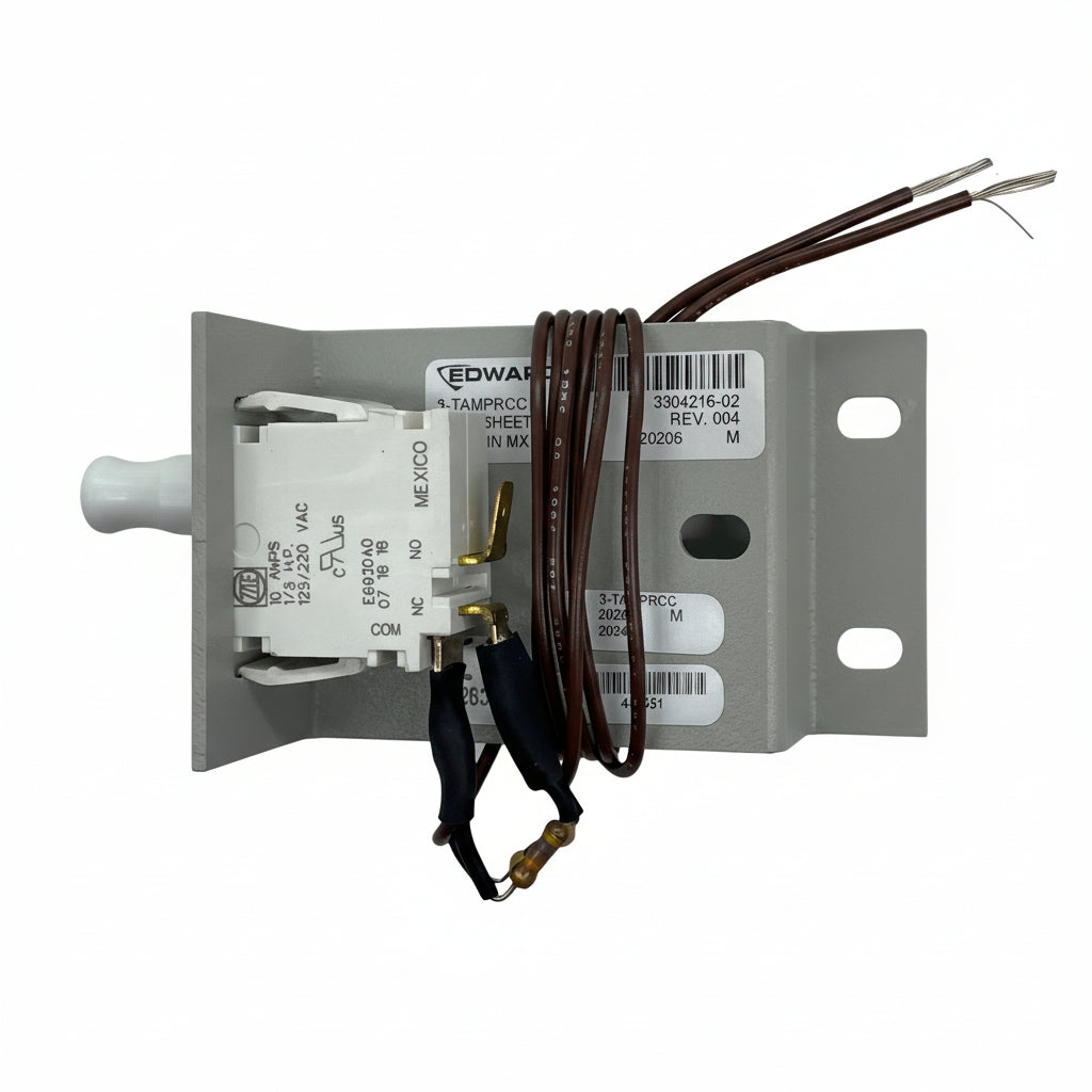 Edwards 3-TAMPRCC fire alarm with manual reset button and test switch, mounted on a white wall for safety monitoring