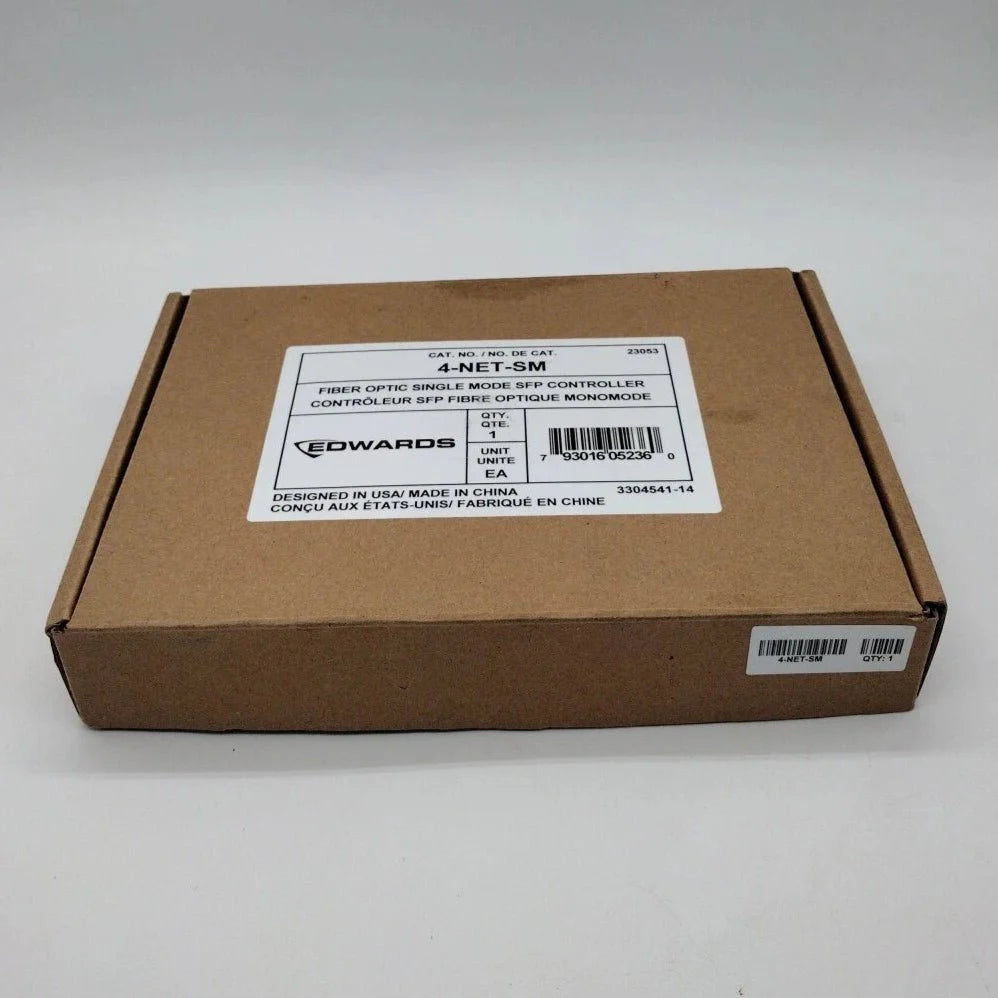 Edwards 4-NET-SM fire alarm with multiple sensor connections, mounted on wall, in a commercial setting.