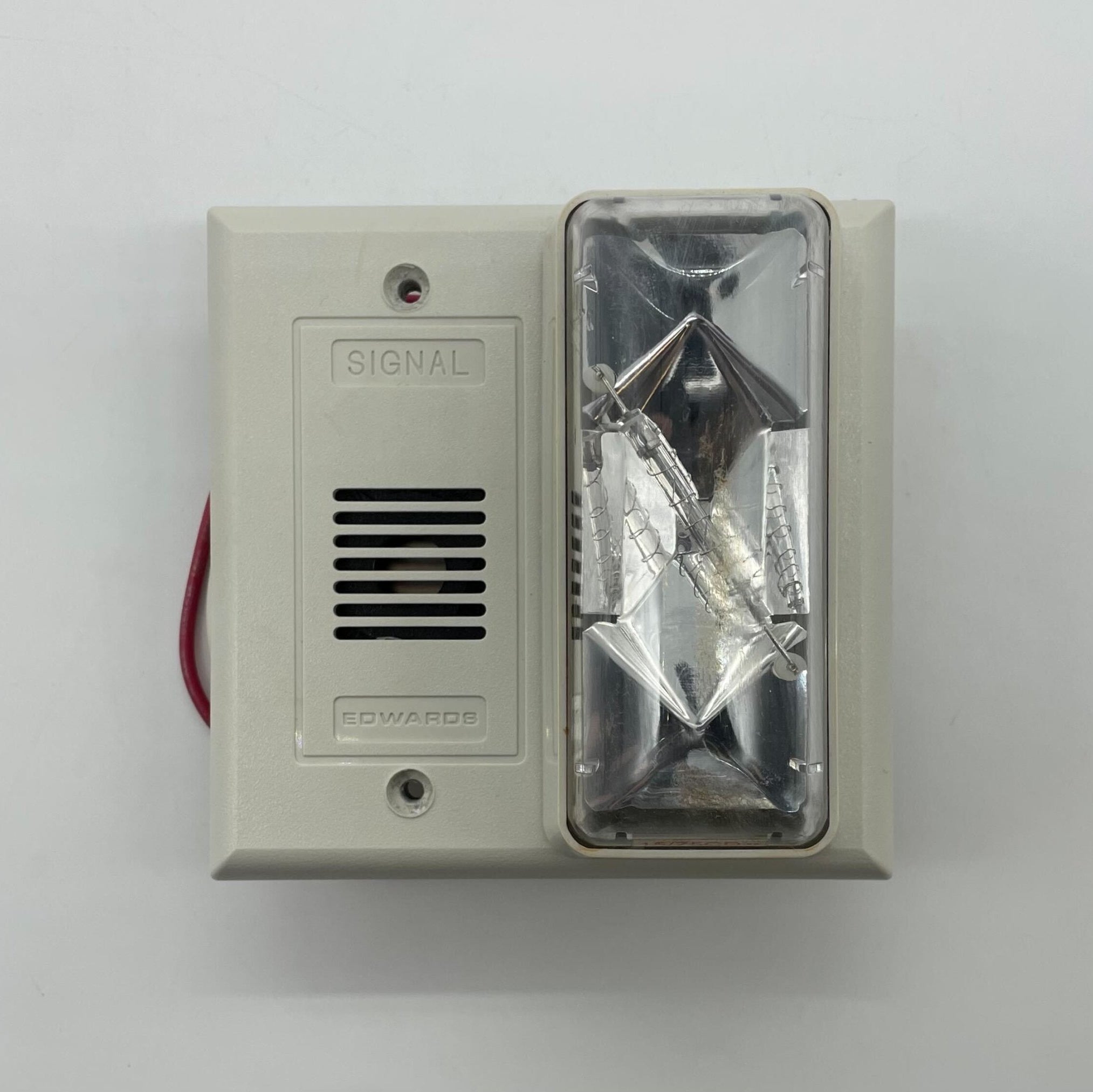 Edwards 6536-G5 fire alarm system sensor with ULC-ZNAC certification, mounted on wall, part of Edwards fire alarm safety system.