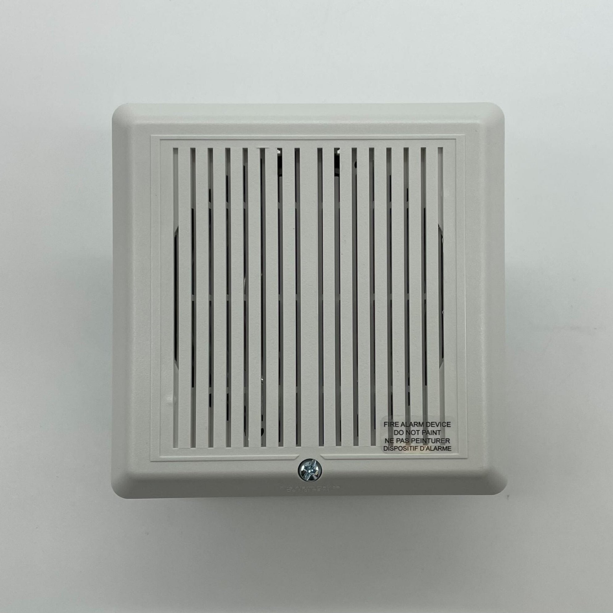 Edwards 757-1A-S70W fire alarm sensor with ULC certification, installed on a ceiling in a building interior.