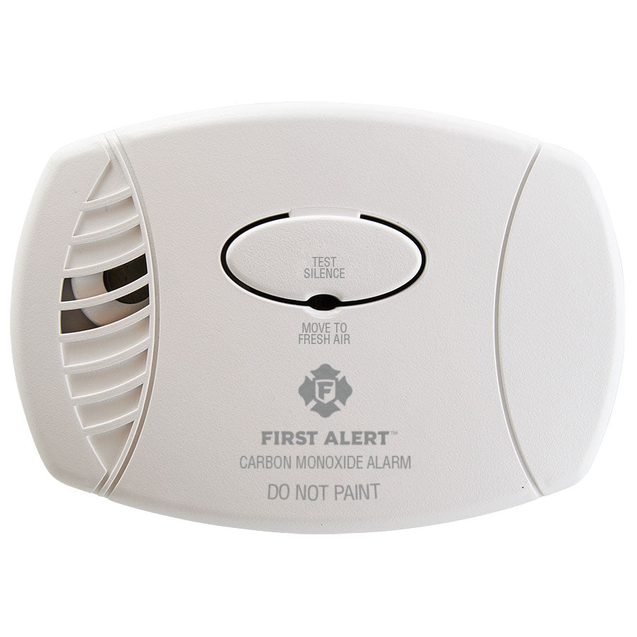 First Alert CO600 carbon monoxide detector mounted on wall with digital display and test button.