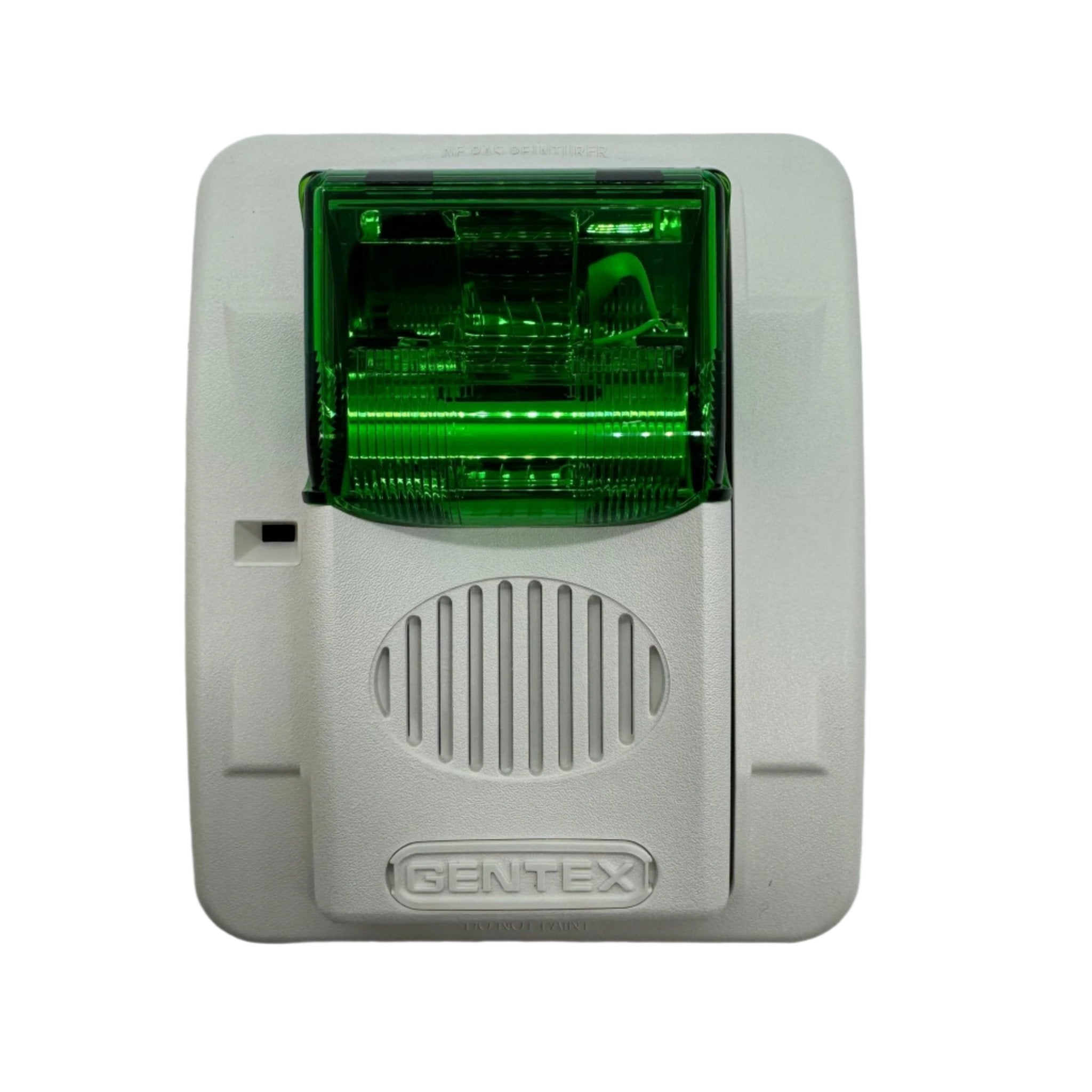 Gentex GECG24PWW fire alarm horn strobe with green lens, mounted on wall, for emergency warning and safety signaling.