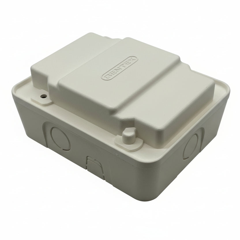 Gentex GTSM-W gangable synchronization module for security systems, shown mounted on a wall with cabling and connectors.