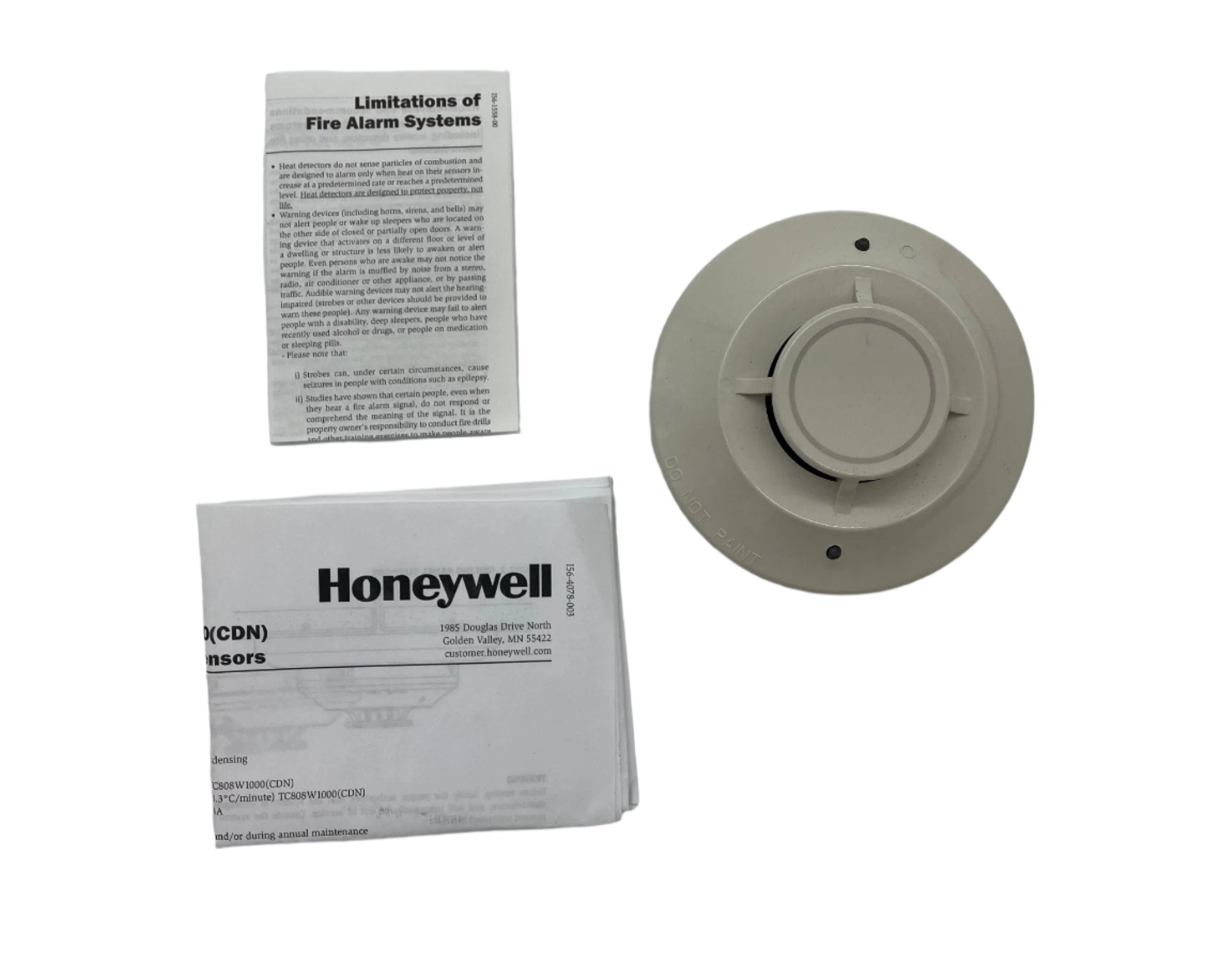Honeywell TC808W1000 thermostat mounted on wall, digital display with control buttons for home climate regulation.